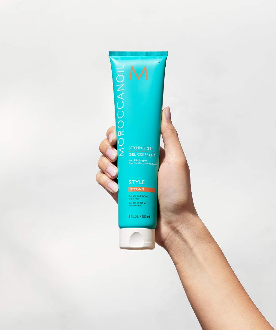 Moroccanoil Strong Styling Gel in a 6 Fl Oz bottle, designed for firm hold and sleek hair styling.