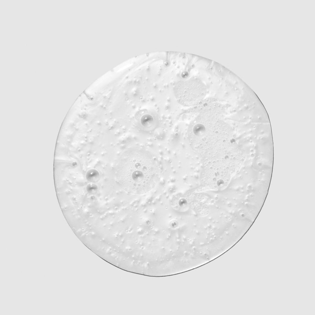 Paul Mitchell Spring Loaded frizz-fighting shampoo bottle, 8.5 oz, with a sleek design and clear label on a white background.