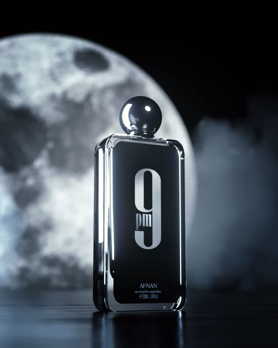 Afnan 9 PM For Men Eau De Parfum bottle with 3.4 fl oz in a sleek design, showcasing the men's personal fragrance.