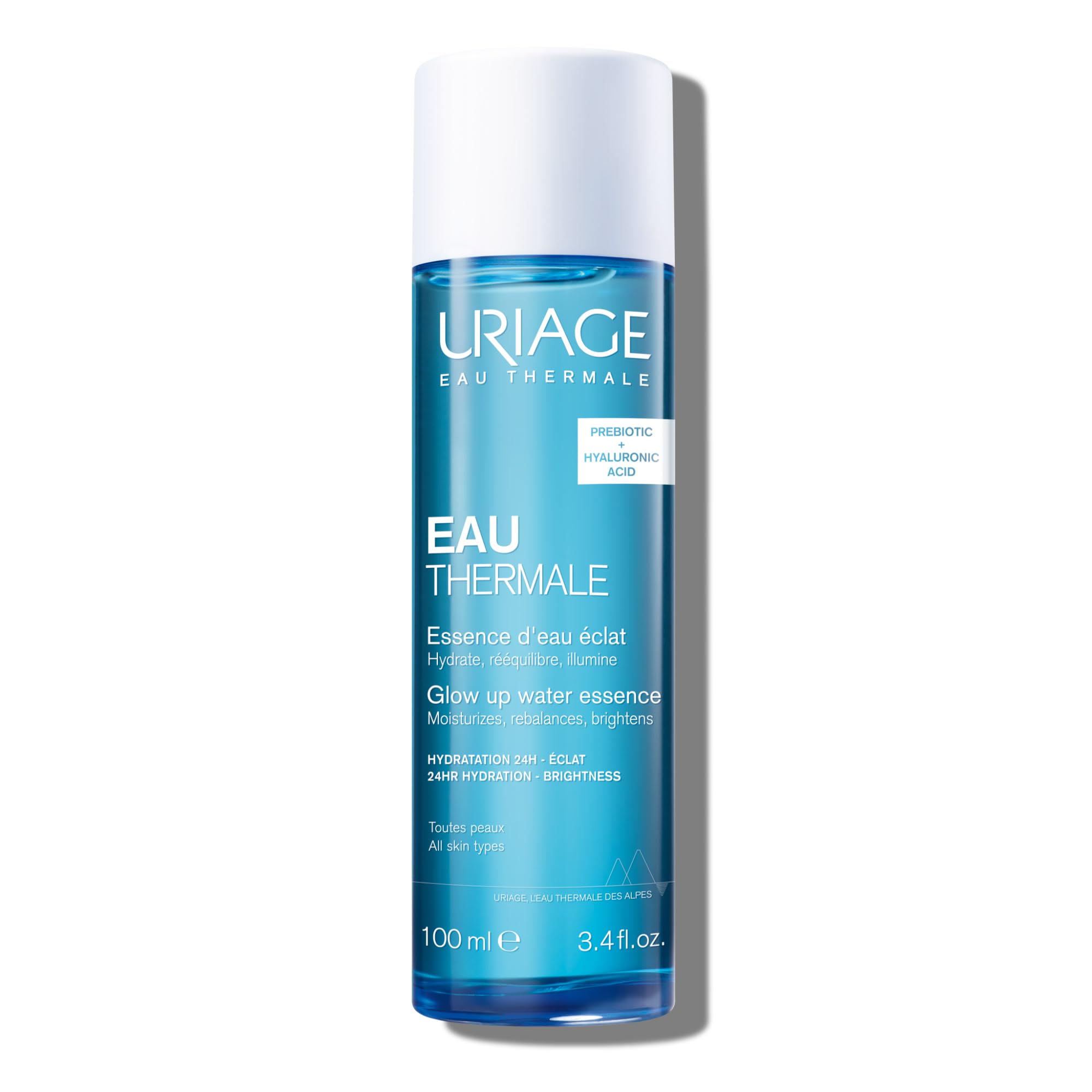 Uriage Water Essence hydration booster with hyaluronic acid, clear bottle showing the skincare product in a skincare setting.