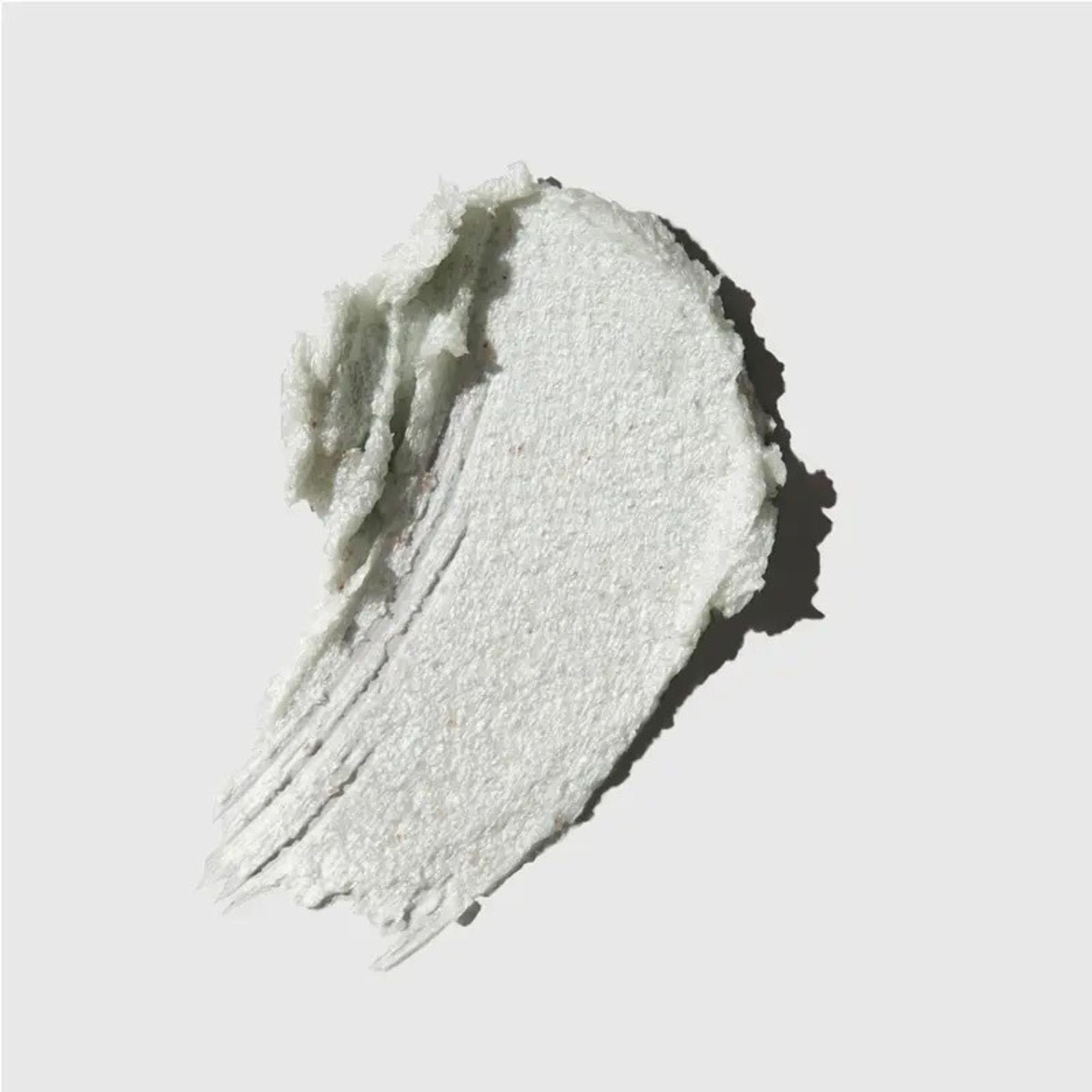 Tea Tree Special Detox Foaming Salt Scrub for hair, showing the exfoliating salt scrub in a clear container for scalp refreshment.