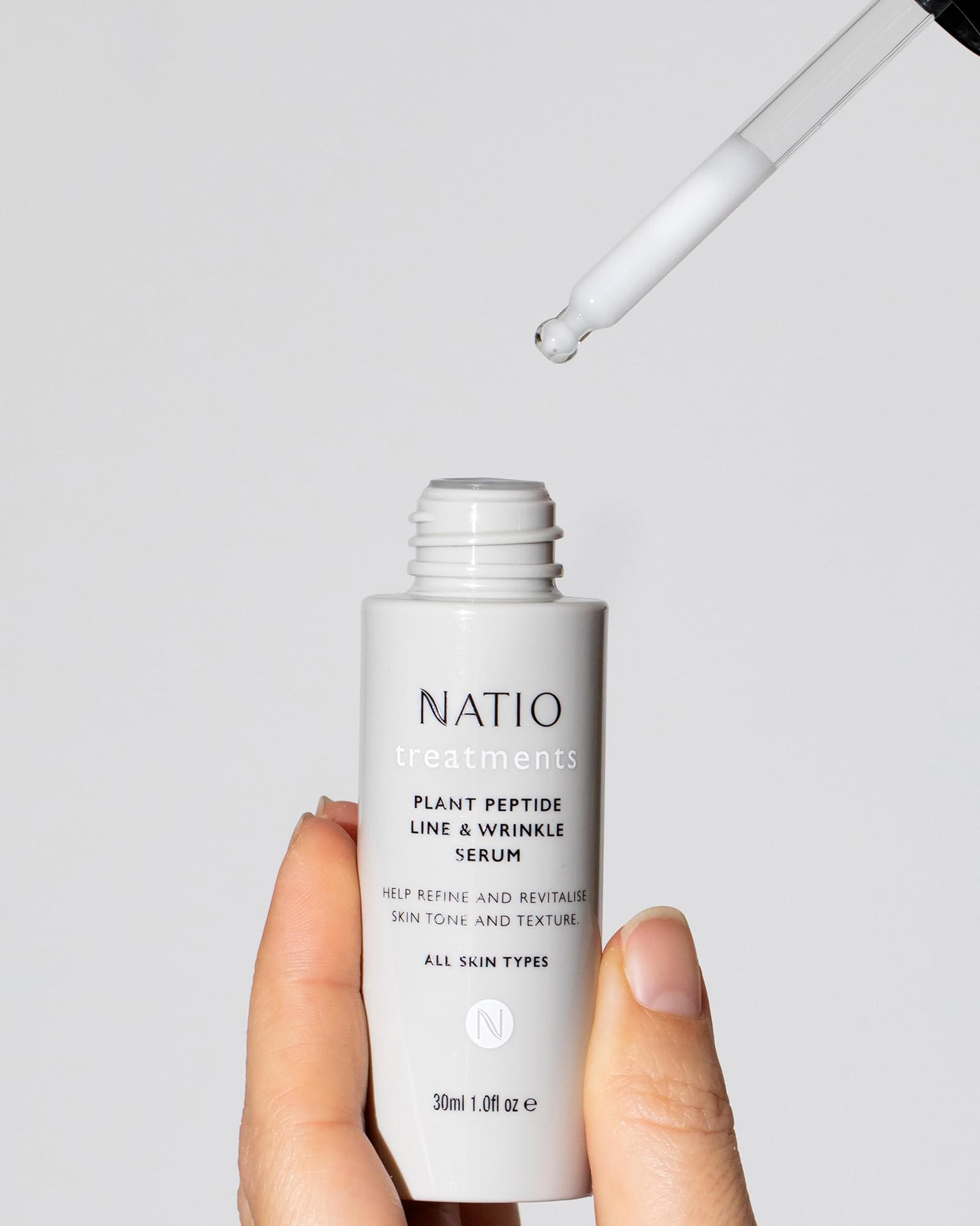 Natio Plant Peptide Line & Wrinkle Serum in 1 oz bottle, smooth and hydrating skin serum with plant-based peptides.