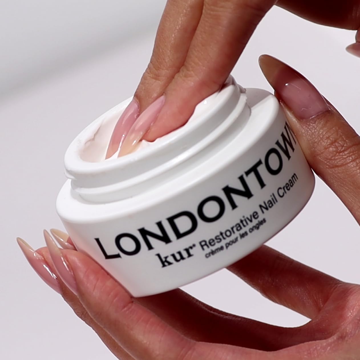 LONDONTOWN kur Restorative Nail Cream for strengthening and nourishing nails, with a smooth, creamy texture in a jar.