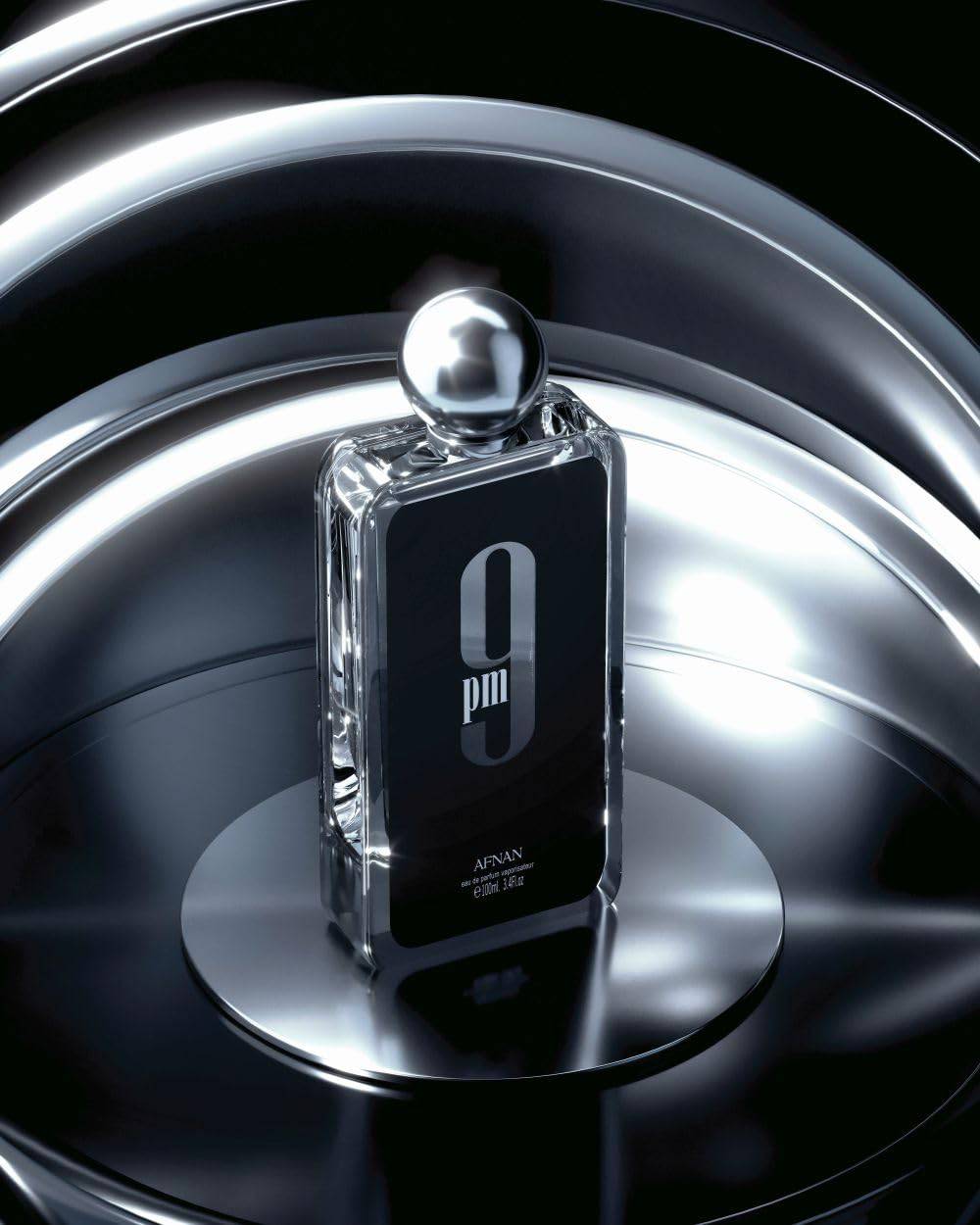 Afnan 9 PM for Men Eau De Parfum bottle, 3.4 fl oz, with a sleek dark design and metallic accents.