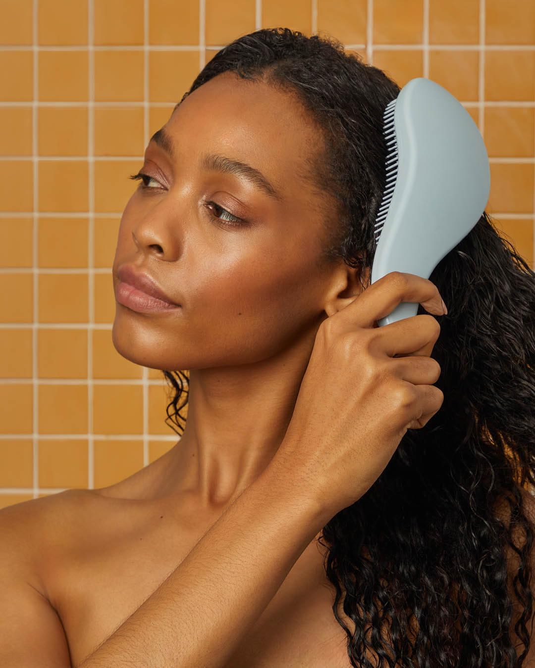 Kitsch Haze Blue detangle hair brush with gentle bristles for smooth, tangle-free hair grooming.
