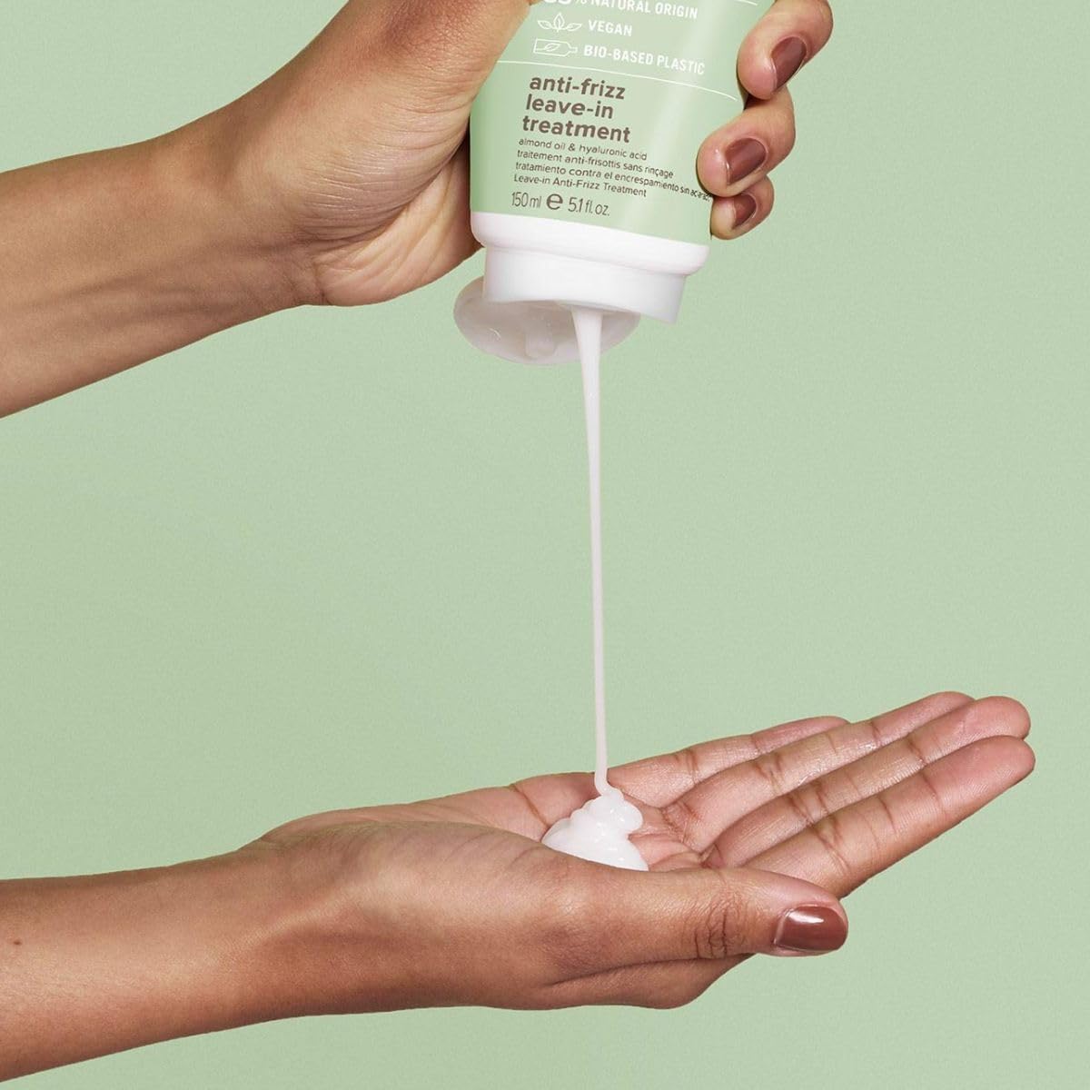 Paul Mitchell Clean Beauty anti-frizz leave-in conditioner in a 5.1oz bottle, designed to smooth and tame frizz for shiny hair.