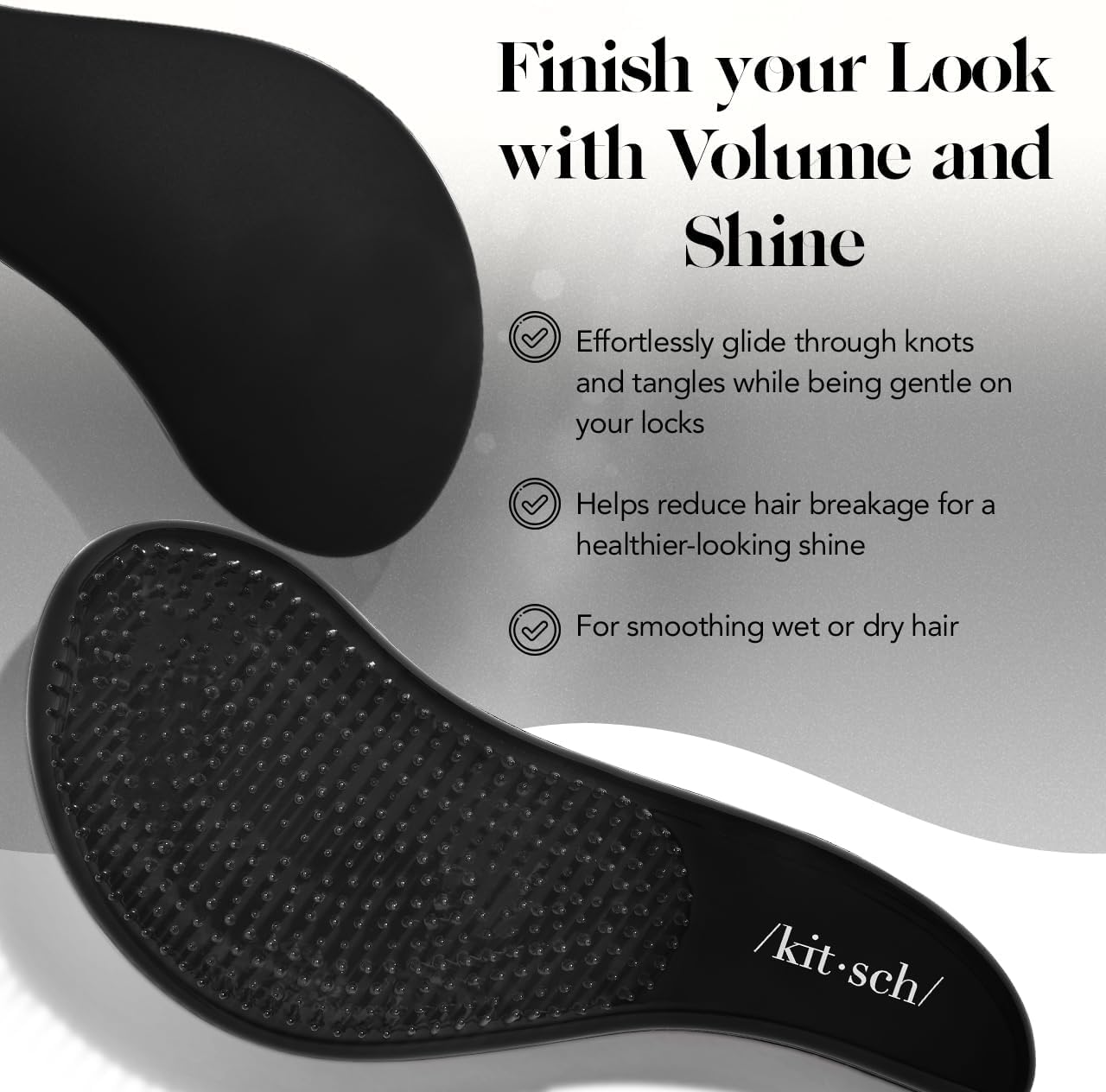 Kitsch detangle hair brush in black designed for gentle detangling of curly hair, with a ergonomic handle and flexible bristles.
