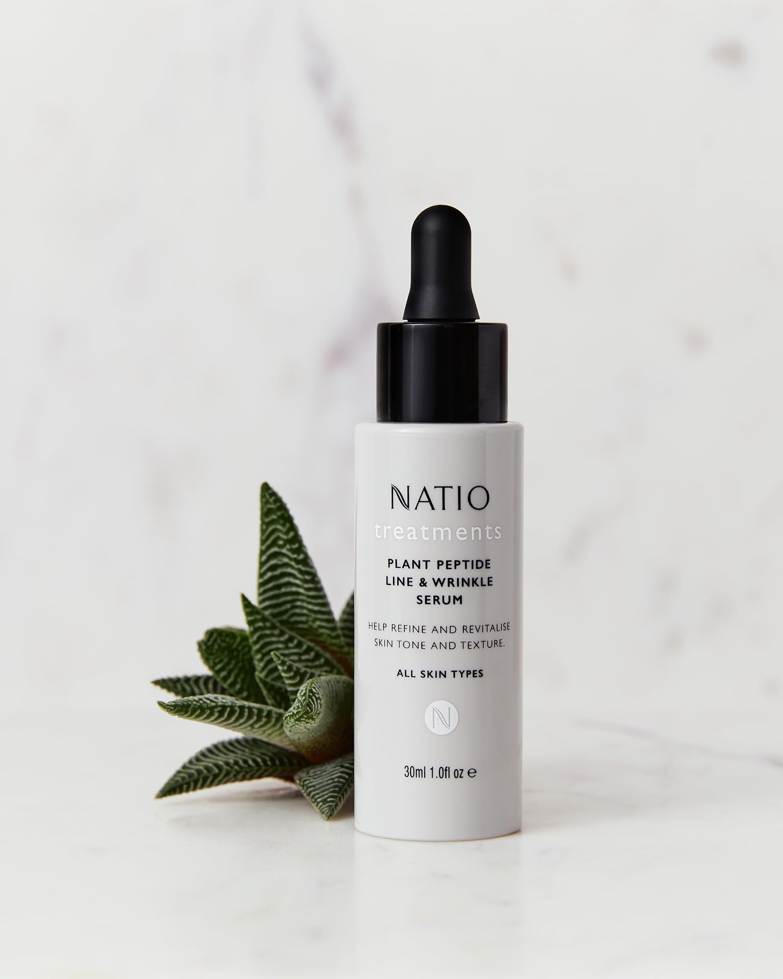 Natio Plant Peptide Line & Wrinkle Serum in 1 oz bottle, skincare serum for anti-aging and skin rejuvenation.