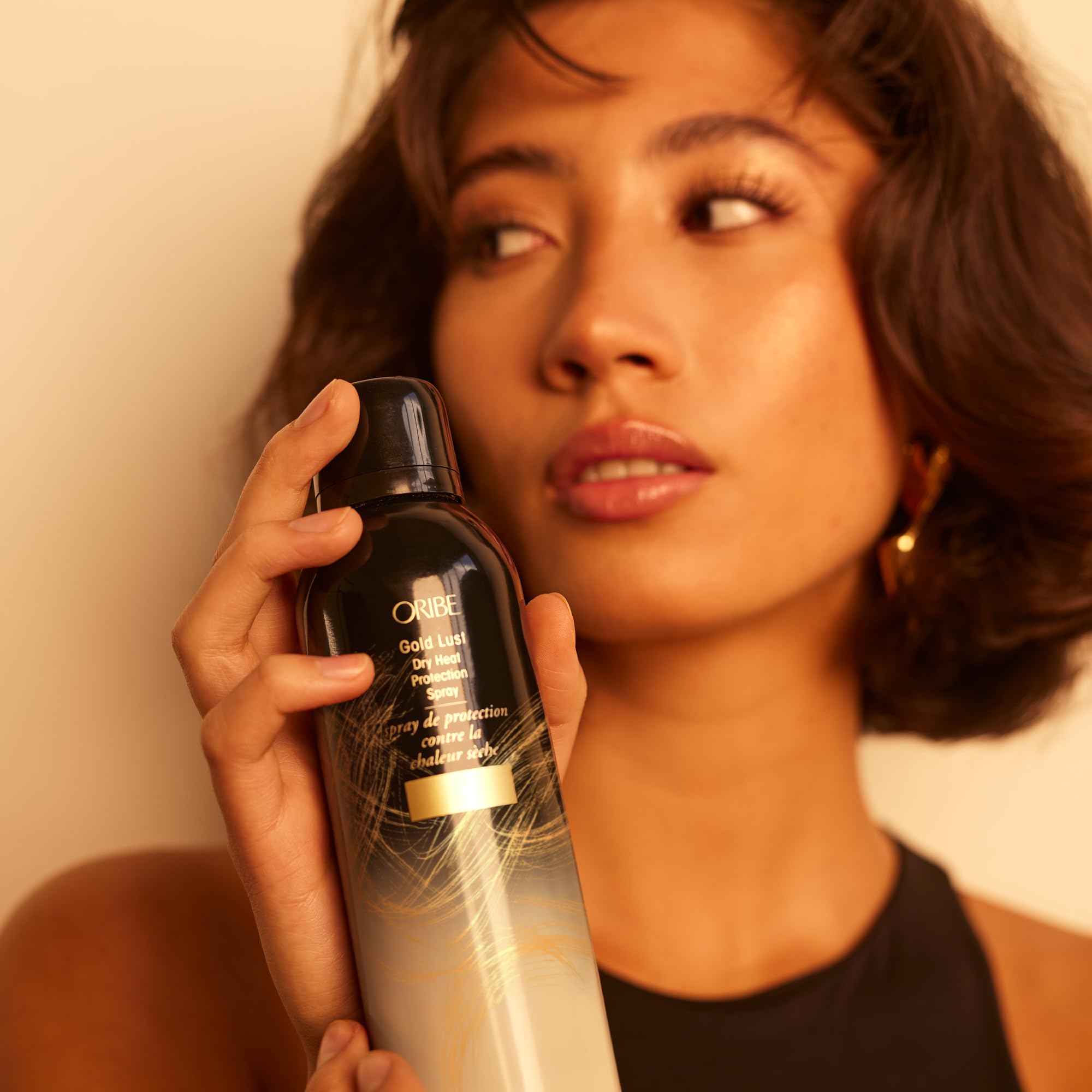 Oribe Gold Lust Heat Protection Spray for hair, 5.2oz, with heat protection up to 450°F, ideal for styling and heat styling tools.