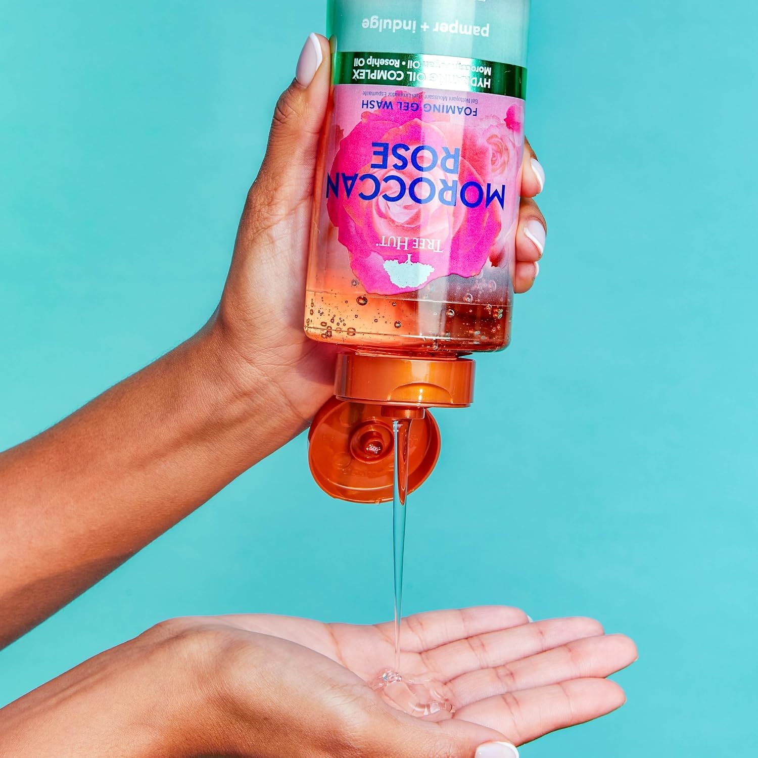 Tree Hut Moroccan Rose foaming gel body wash in 18 oz bottle, featuring a floral rose scent and skin cleansing formula.