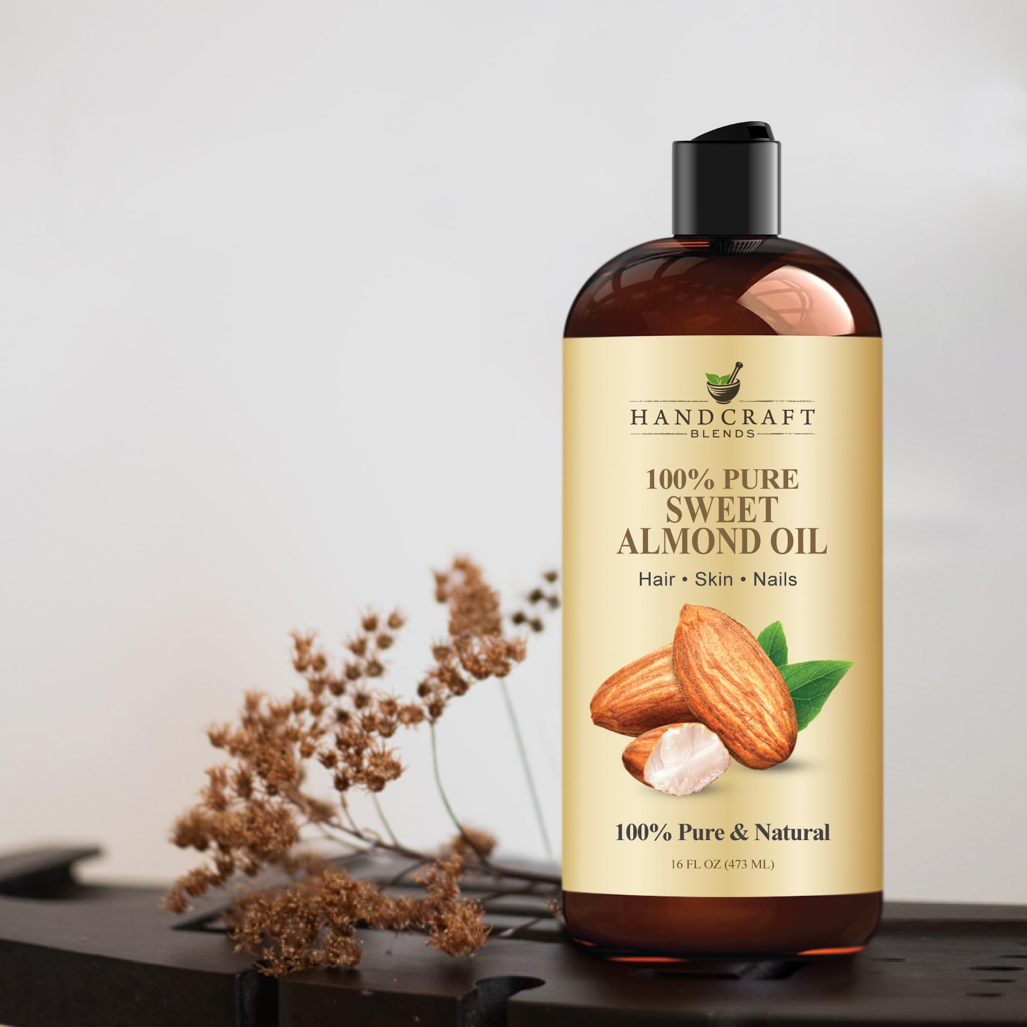 Handcraft Sweet Almond Oil 100% pure in a 16oz bottle, ideal as a bathwater additive for moisturizing and soothing skin.