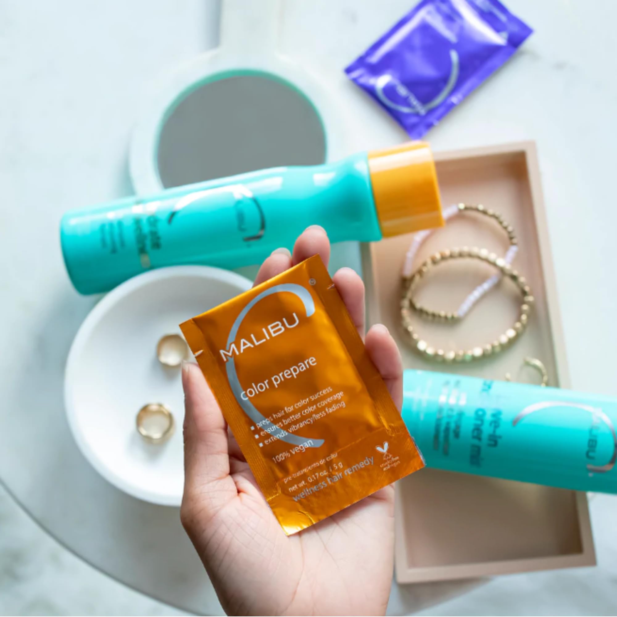 Malibu C Color-Safe Shampoo and Hydrating Hair Remedy Kit with bottles of shampoo and conditioner for color-treated hair.