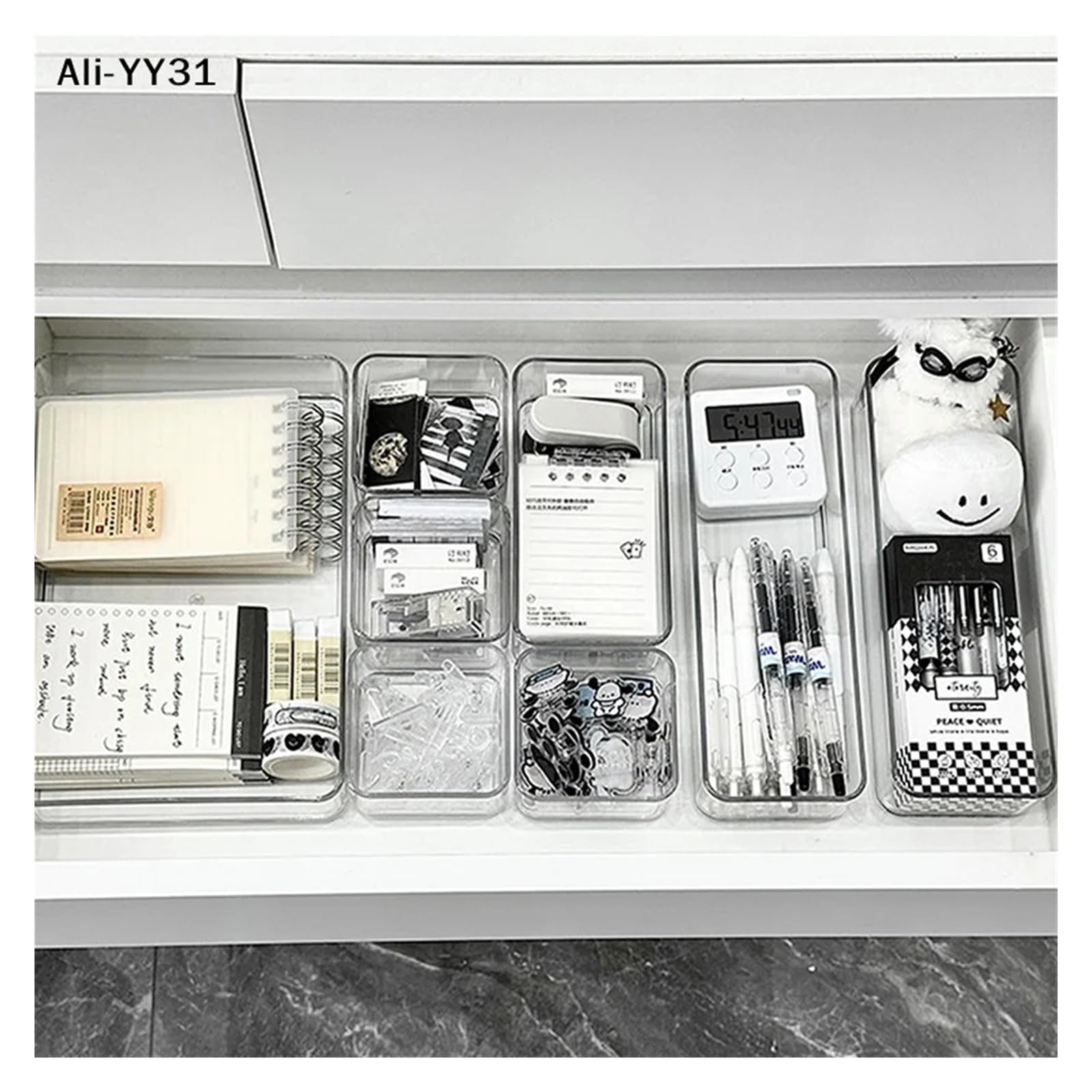 Stackable acrylic drawer organizer caddy with adjustable dividers for cosmetics and makeup storage, modular tray system.