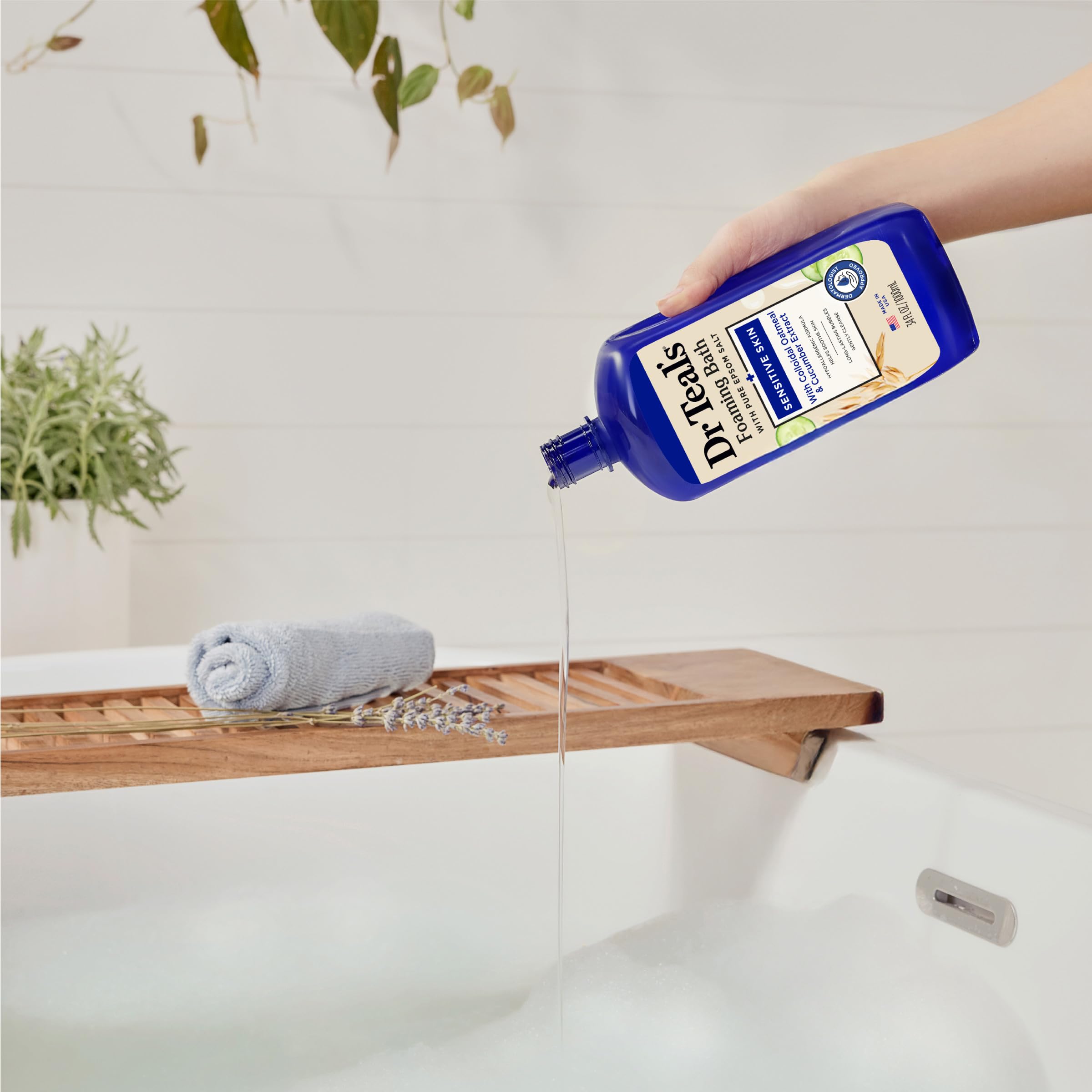 Dr Teal's foaming bath with Epsom salt, colloidal oatmeal, and cucumber for sensitive skin, 34 fl oz bottles in a pack of four.
