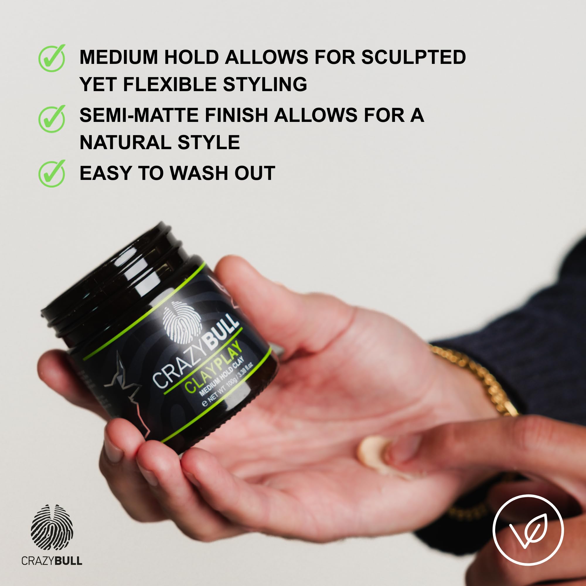 Crazy Bull Hair Play Medium Hold Clay with volcanic ash for men, showing the product jar and textured hair styling in a natural setting.