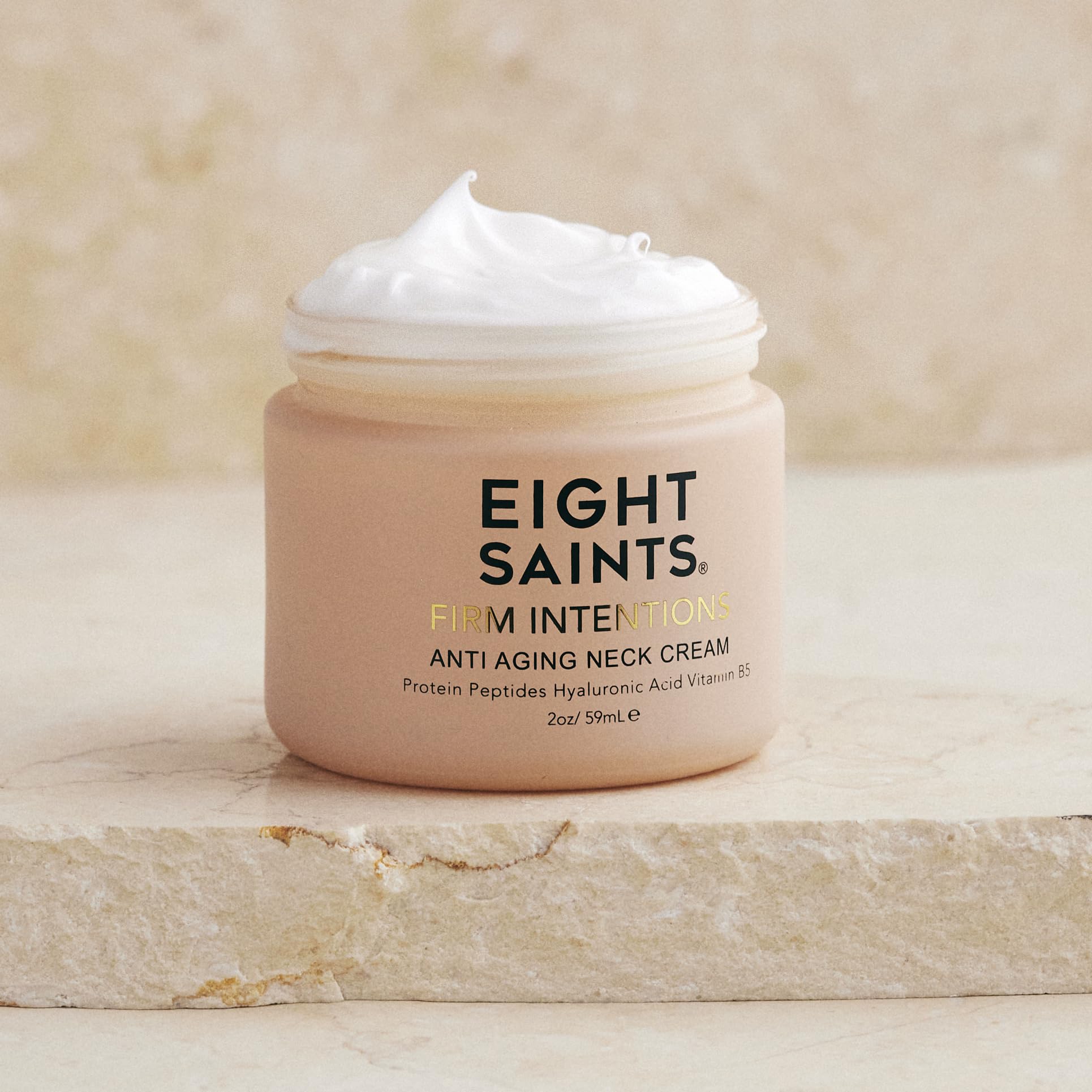Eight Saints Firm Intentions anti-aging neck cream in 2 oz jar, with protein peptides, hyaluronic acid, and niacinamide for skin firming.