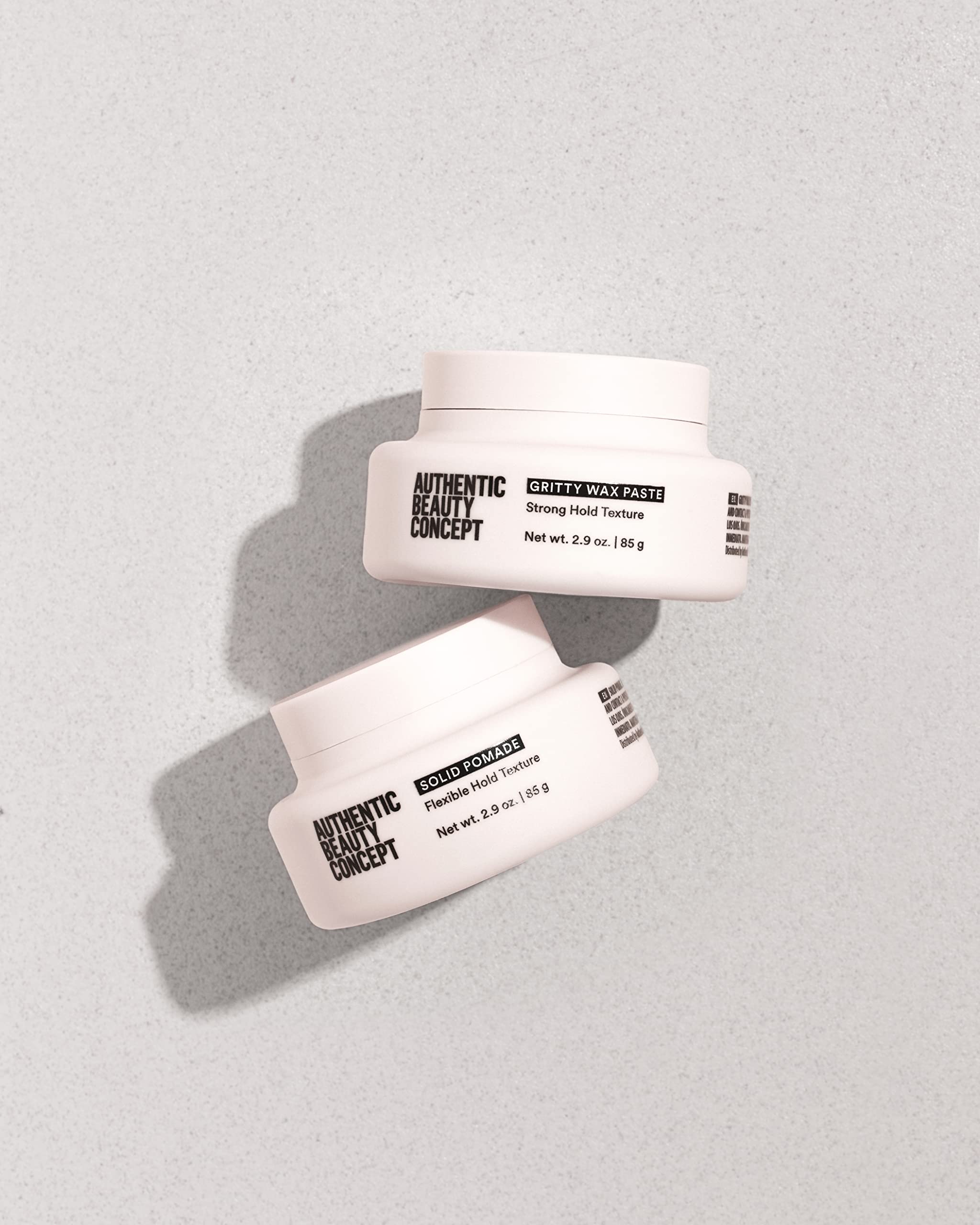 Authentic Beauty Concept solid hair pomade in 2.9 oz jar, provides medium hold and shiny finish for all hair types.