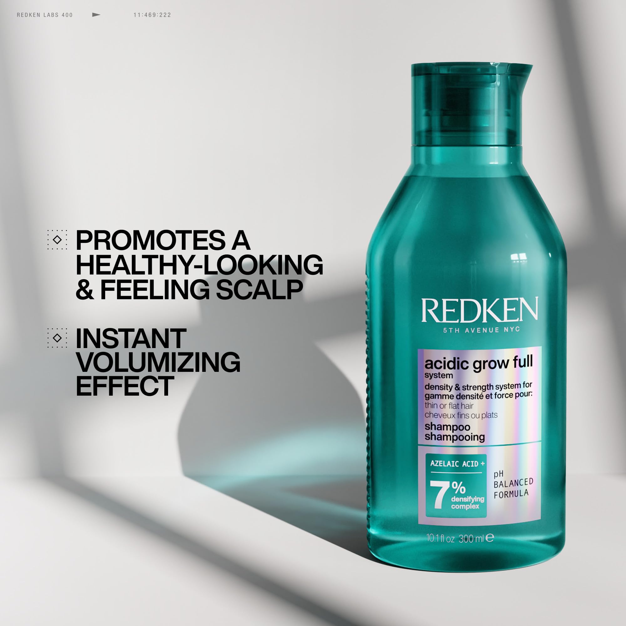 Redken Acidic Grow Full Densifying Shampoo bottle showing scalp moisturizing formula, 10.1 fl oz, for fuller hair and scalp health.