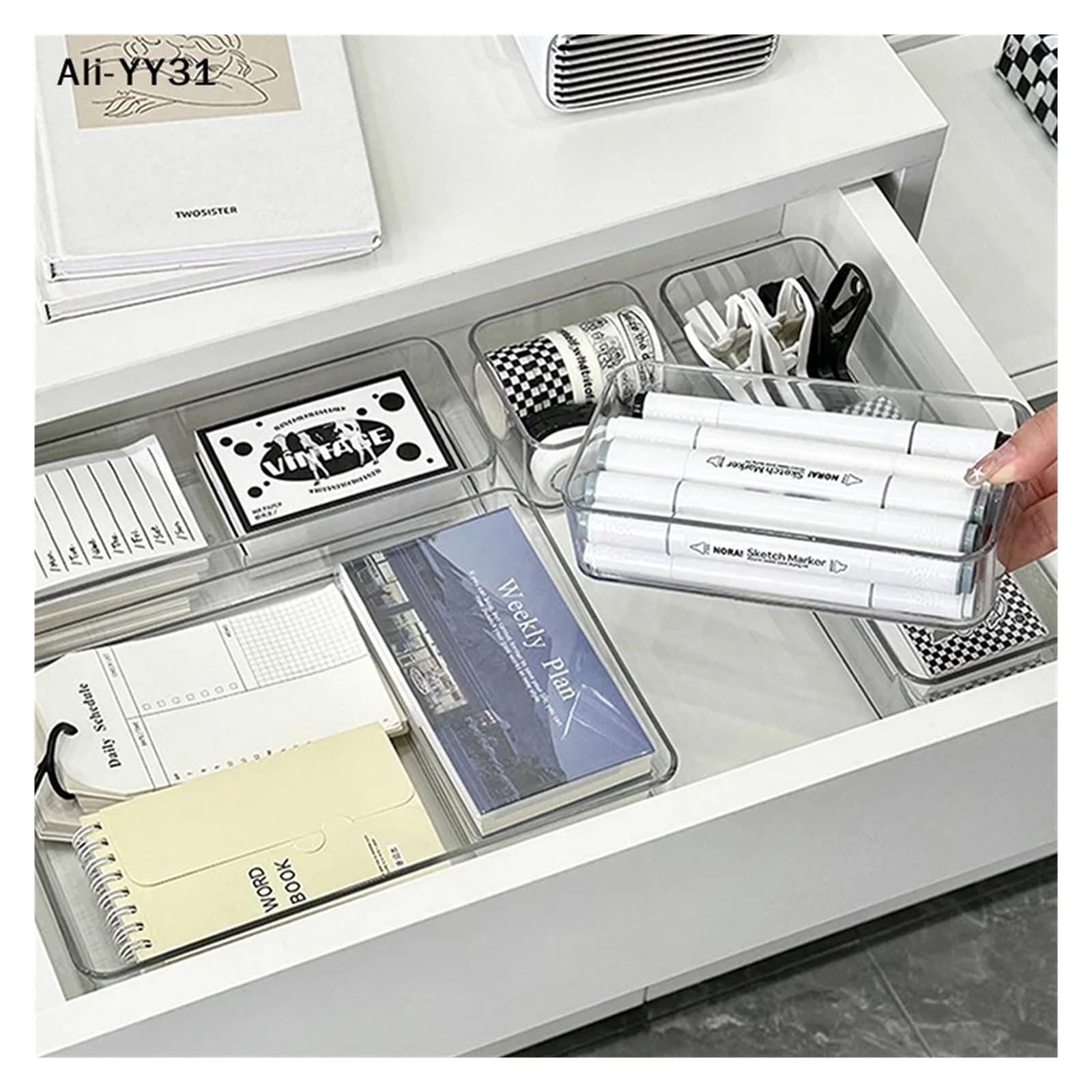 Stackable acrylic caddy with adjustable dividers for cosmetics, modular makeup storage tray showing multiple compartments.