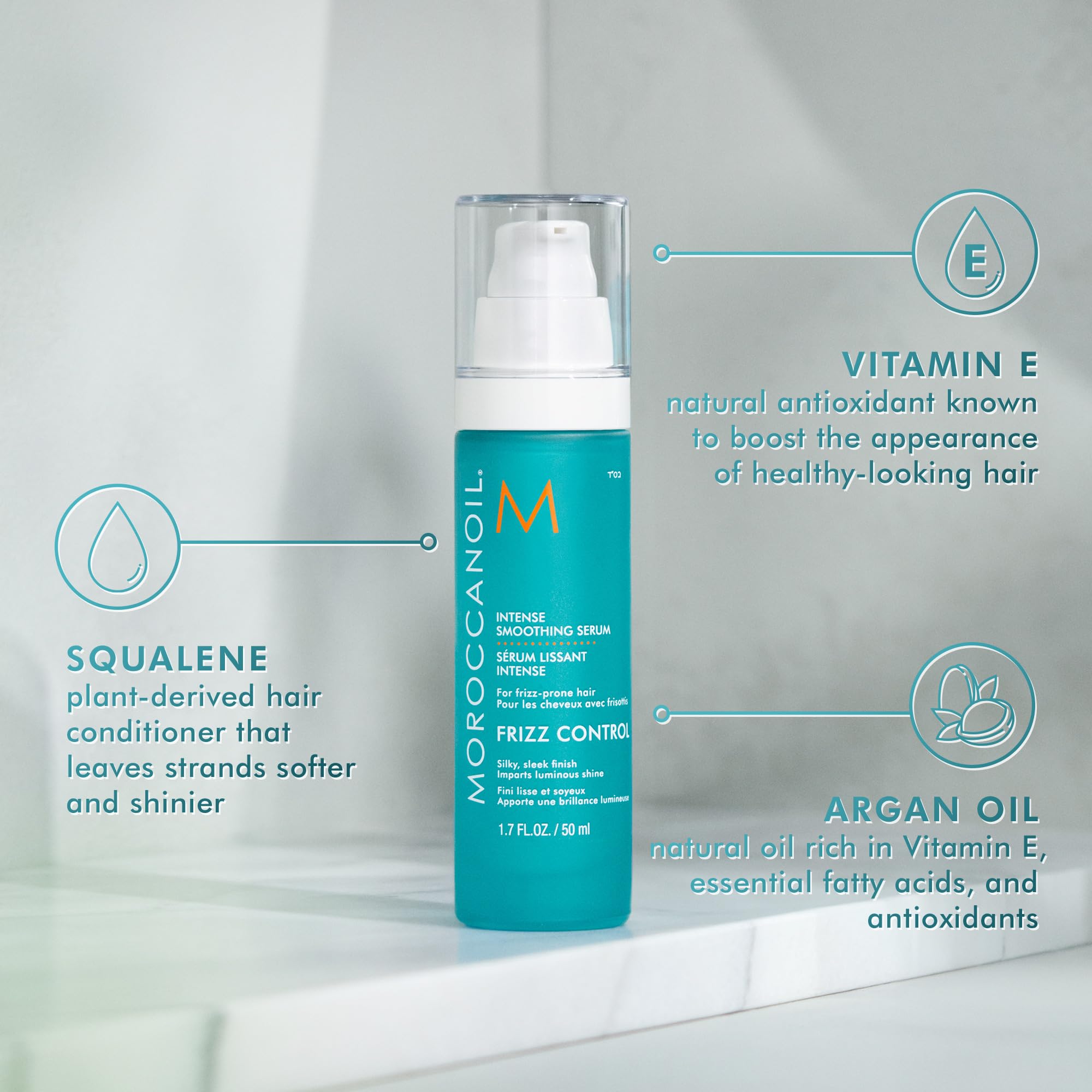 Moroccanoil Intense Smoothing Frizz Control Serum applied to smooth and tame frizzy hair, 1.7 fl oz bottle.
