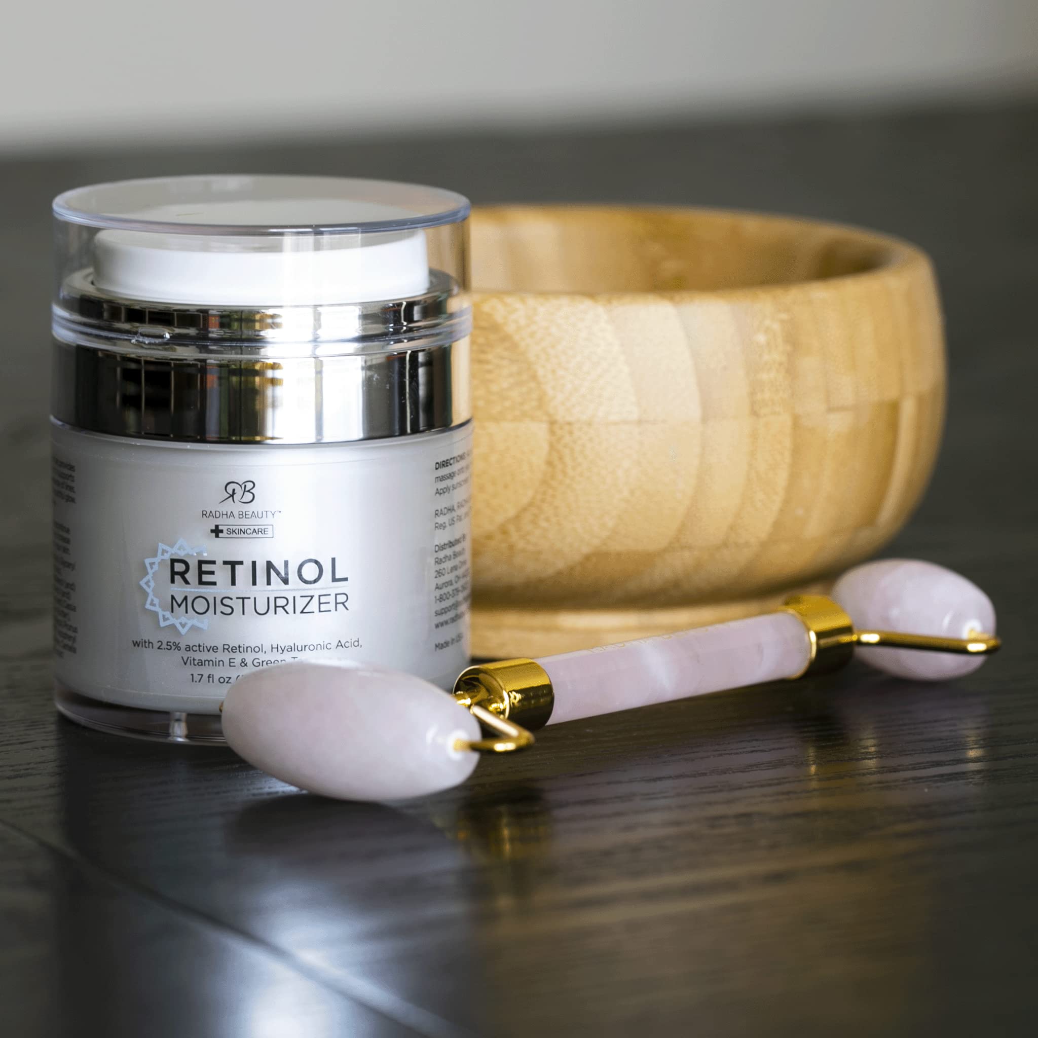 Radha Beauty Moisturizing Miracle Retinol Cream for face with retinol, hyaluronic acid, vitamin E, and green tea in a 1.7 fl oz jar.