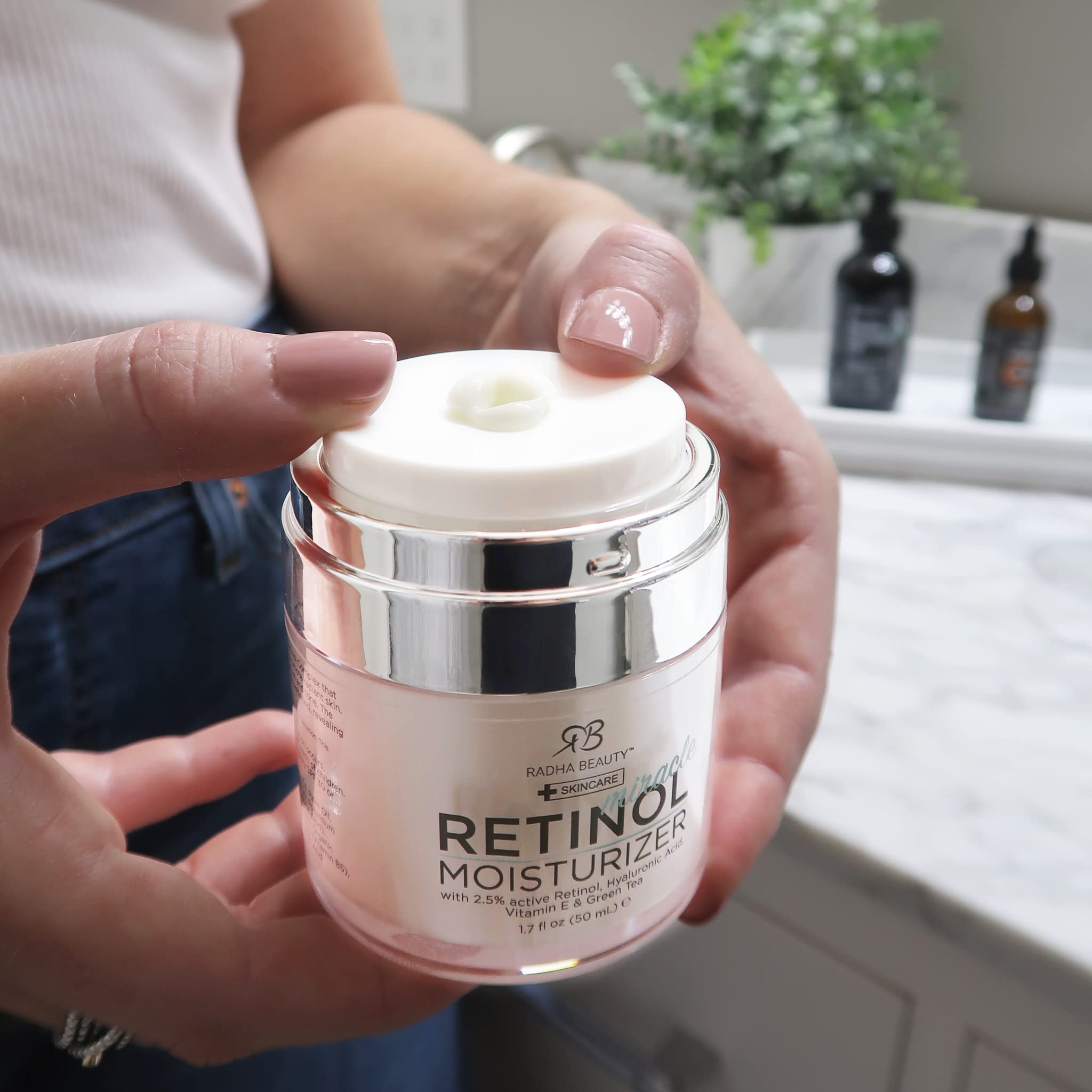 Radha Beauty Moisturizing Miracle Retinol Cream for face with retinol, hyaluronic acid, vitamin E, and green tea in a 1.7 oz jar.