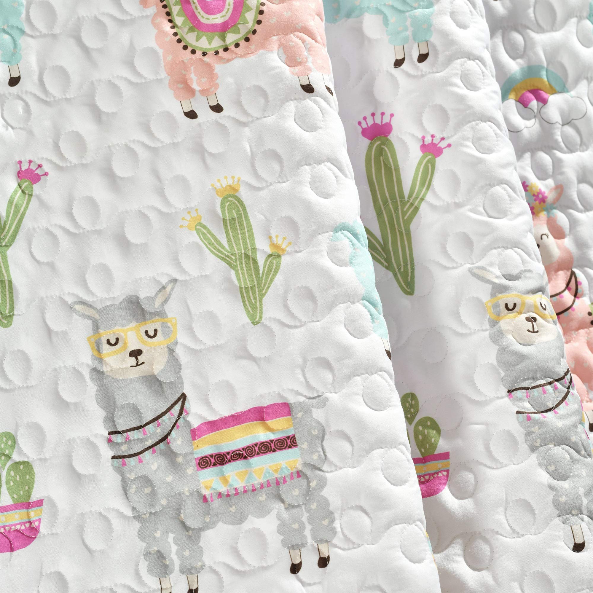Lush Decor Southwest llama cactus toddler blanket with white and blush boho quilted design, reversible for kids' room decor.
