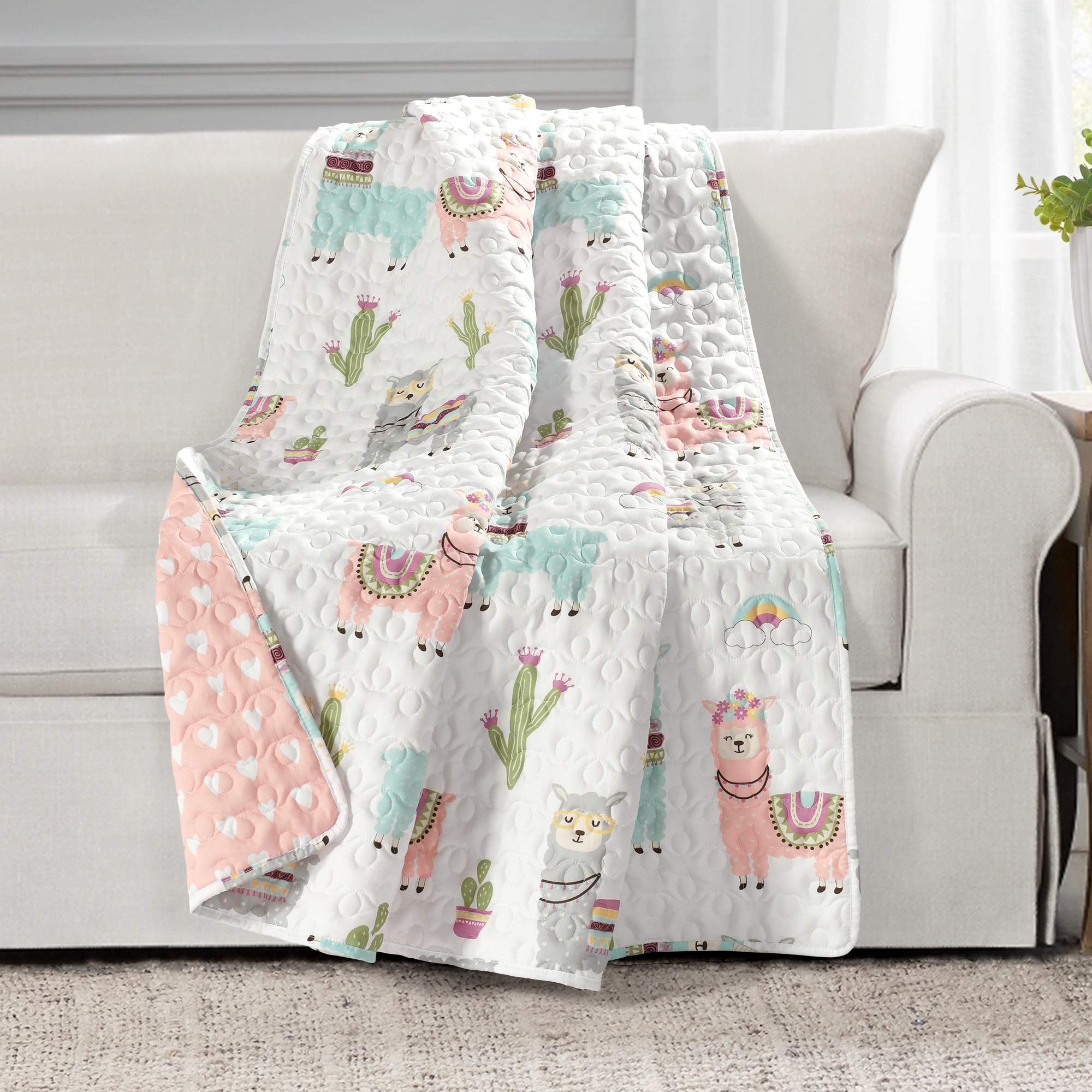 Lush Decor Southwest Llama cactus toddler blanket, white and blush, reversible boho quilted throw for kids' room decor.