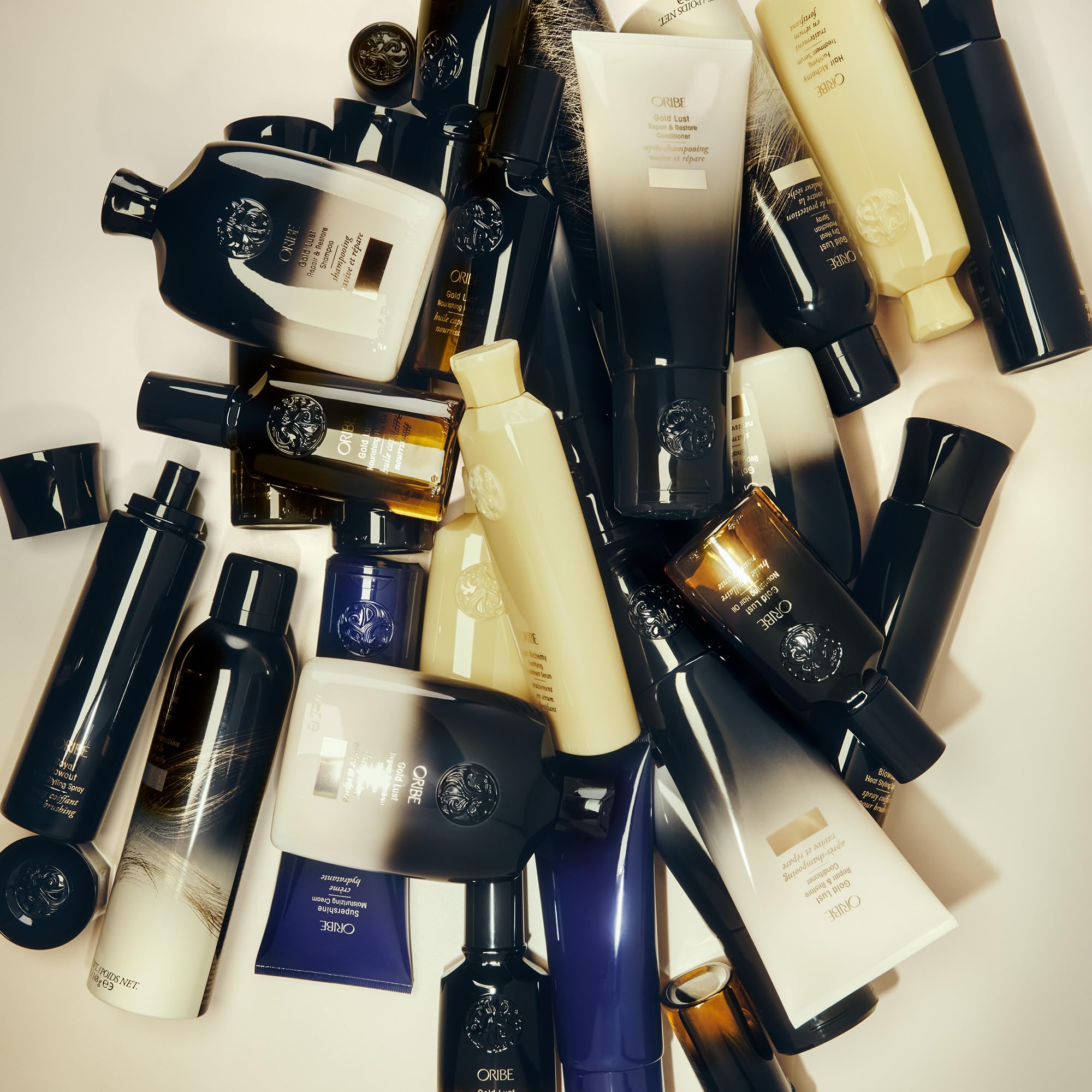 Oribe Gold Lust Heat Protection Spray in 5.2oz bottle, designed for hair styling and heat protection up to 450°F.