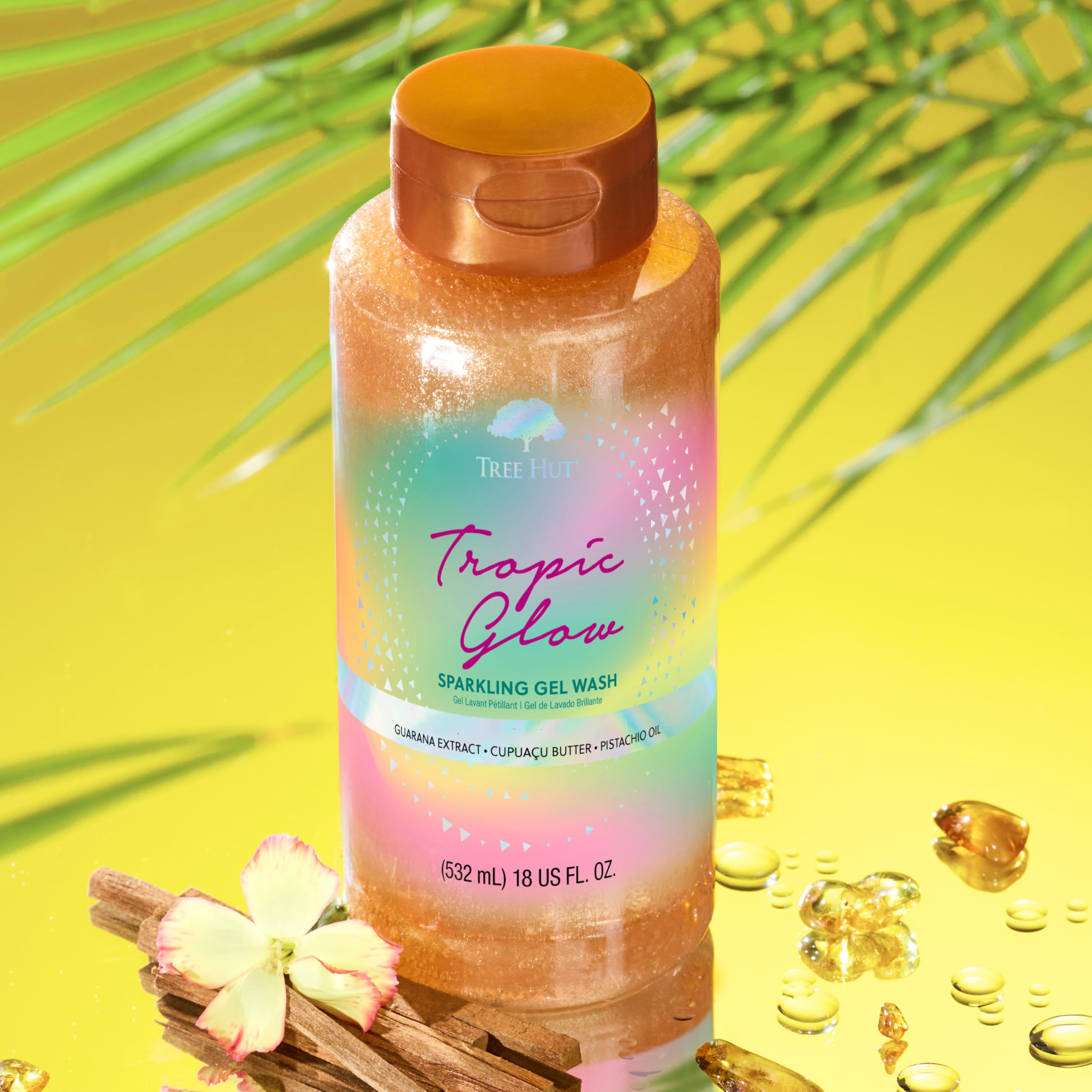 Tree Hut Tropic Glow foaming body wash in 18 fl oz bottle, with tropical scent and vibrant packaging.
