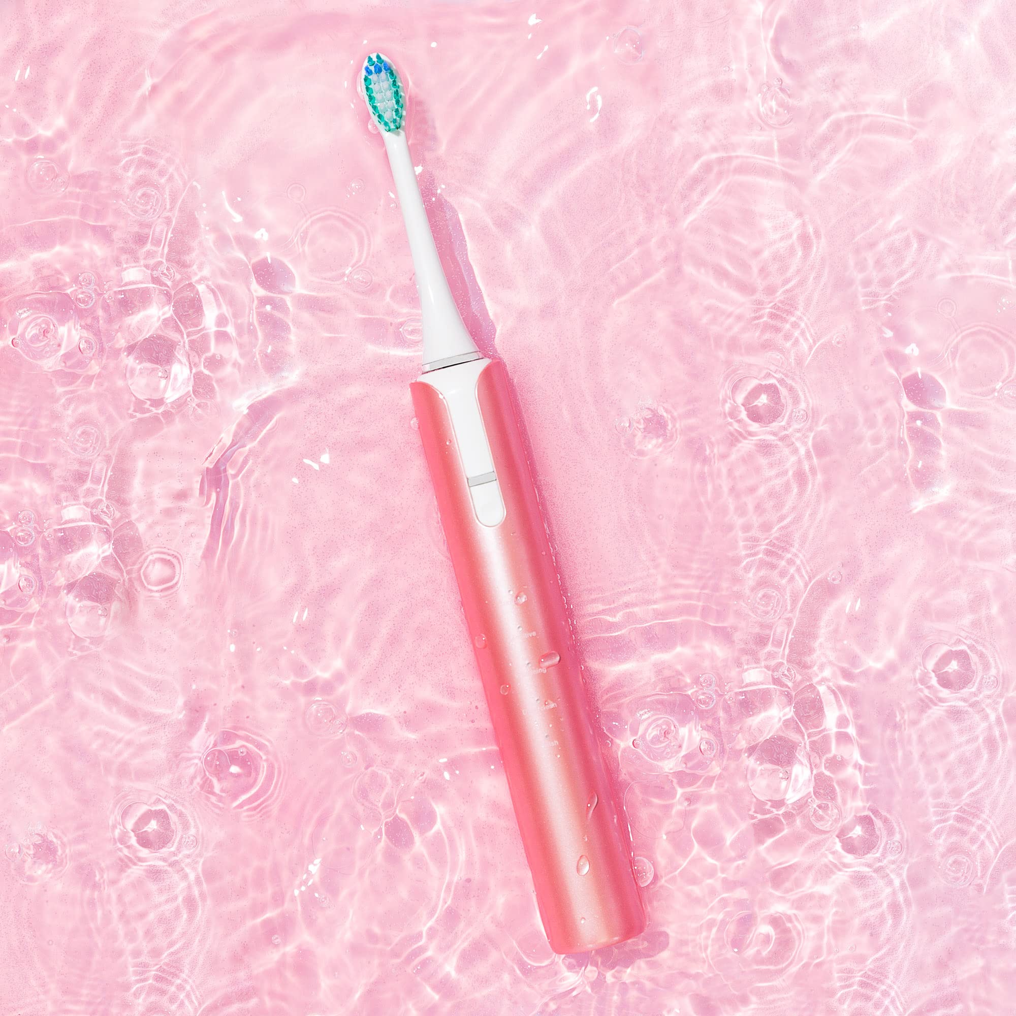 Soniclean Lux Sonic Toothbrush for Adults in rose gold with 6 replacement heads, rechargeable and automatic electric toothbrush.
