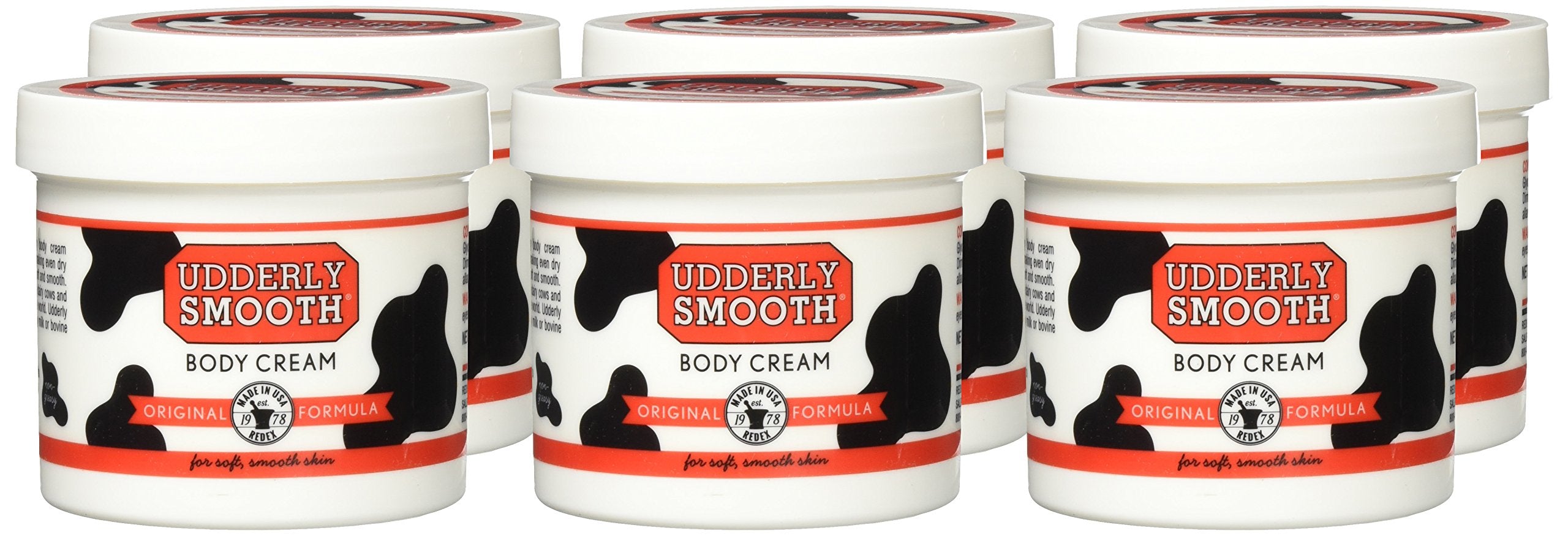 Udderly Smooth Body Cream skin moisturizer in a 6-pack, featuring creamy texture and soothing hydration for dry skin.