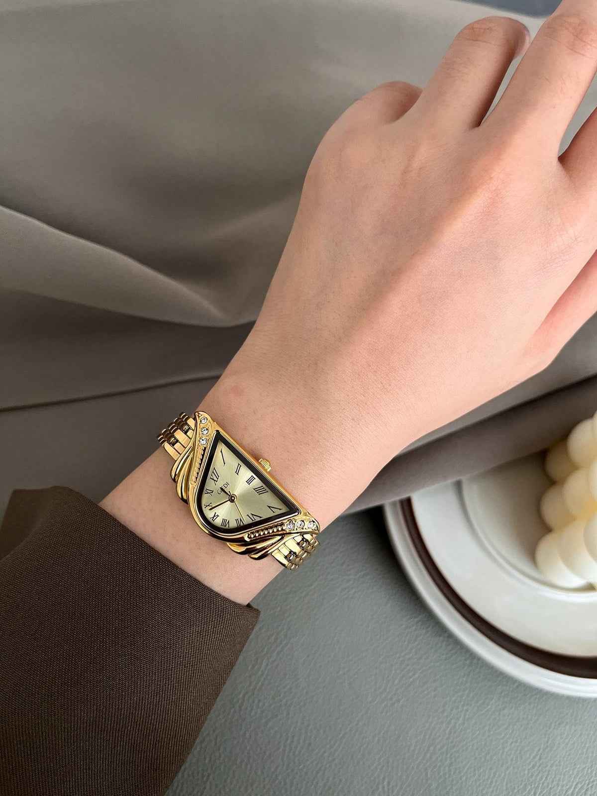 Gosasa Unique Triangle Watch for Women, Dainty Bracelet Quartz Dress Watch – close-up detail in Gold