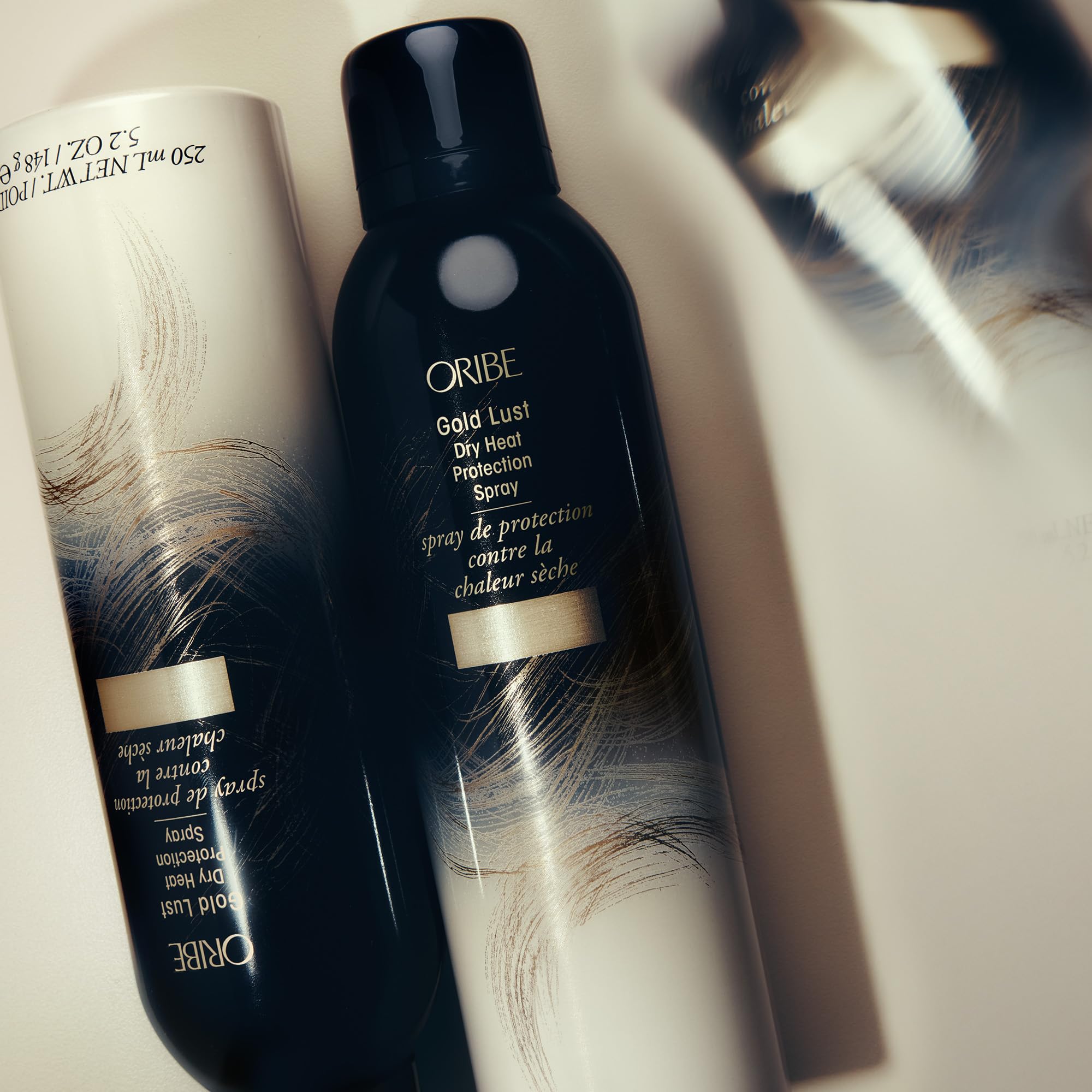 Oribe Gold Lust Heat Protection Spray for hair, 5.2oz, providing heat protection up to 450°F for styling and styling agents.