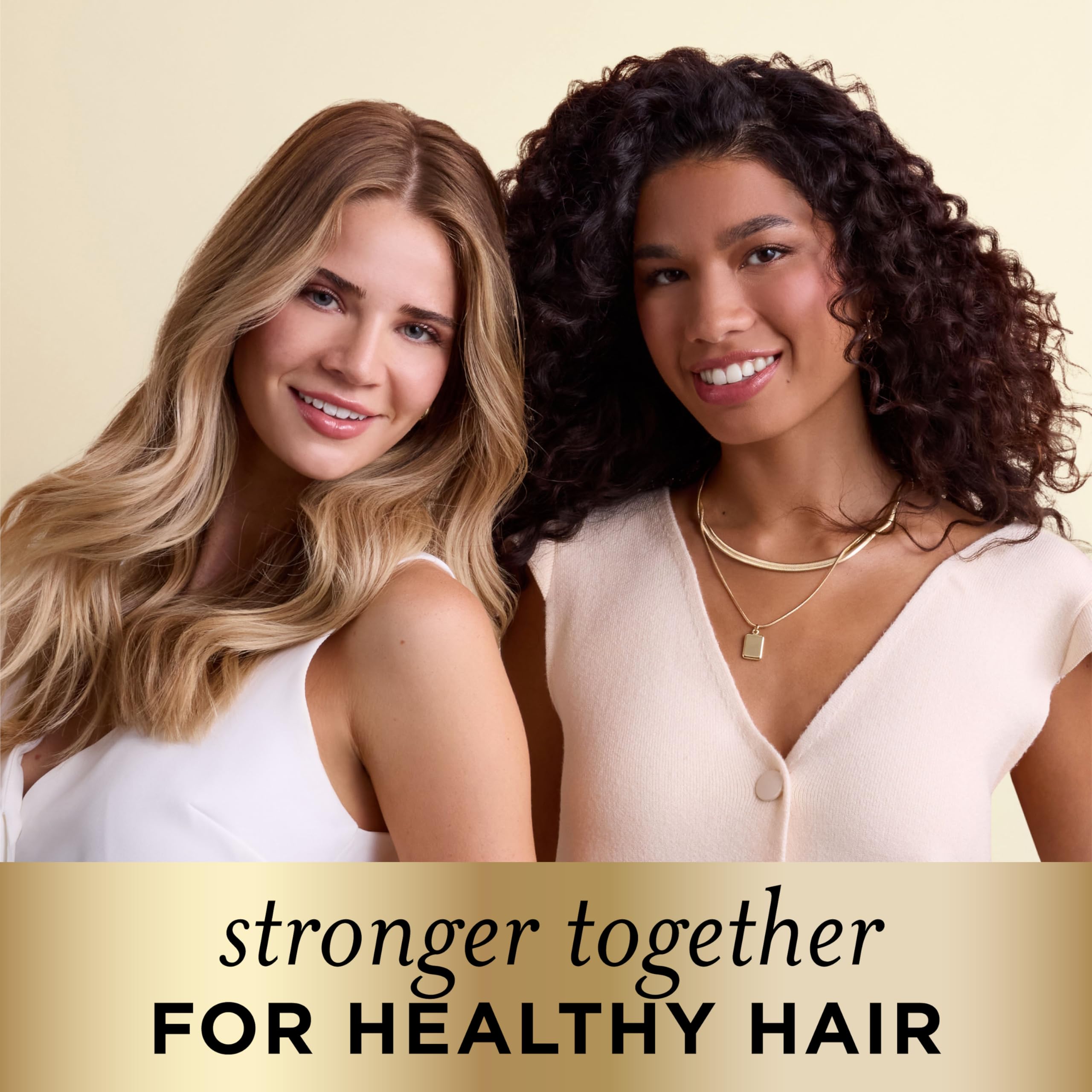 Pantene Smooth & Sleek Shampoo and Conditioner set in large 52.8 oz bottles, designed for shiny, smooth hair.