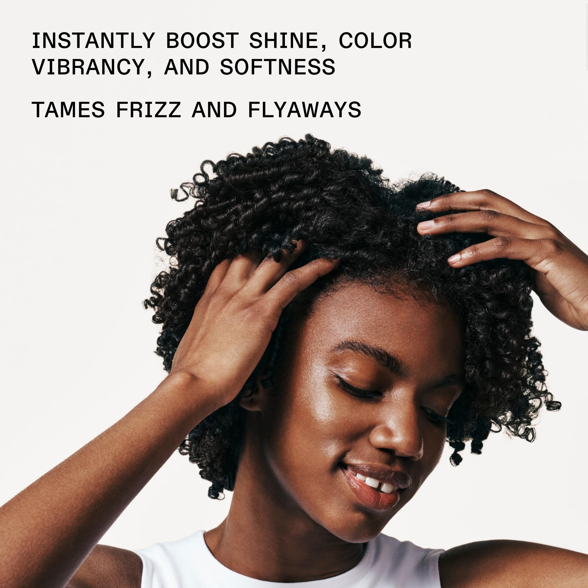 Olaplex N°.7 Bonding Hair Oil bottle showing high shine and sleek hair, 30 mL styling treatment for damaged hair.