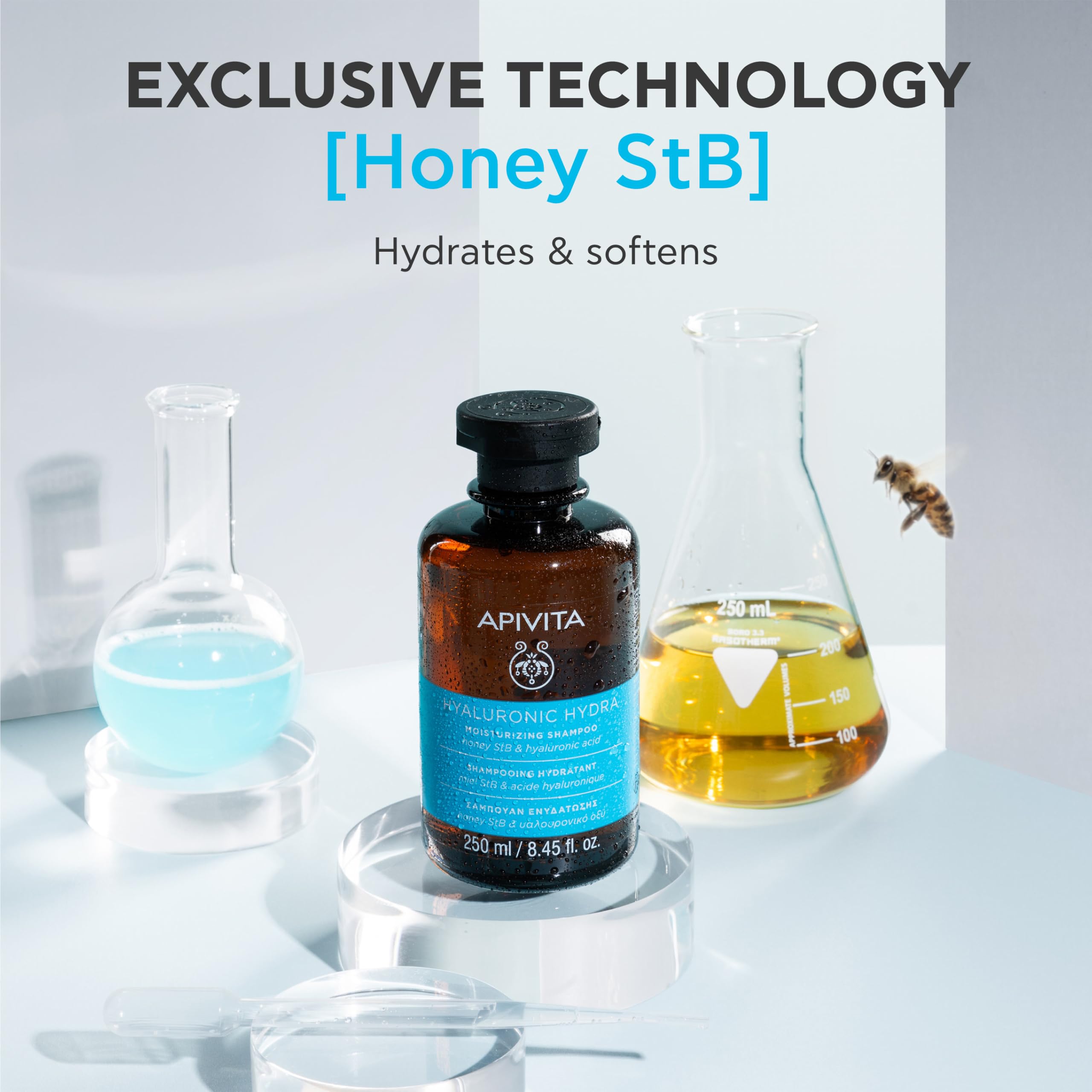 Apivita Hyaluronic Hydra Shampoo with honey and hyaluronic acid, showing a clear shampoo bottle with honey and floral elements.