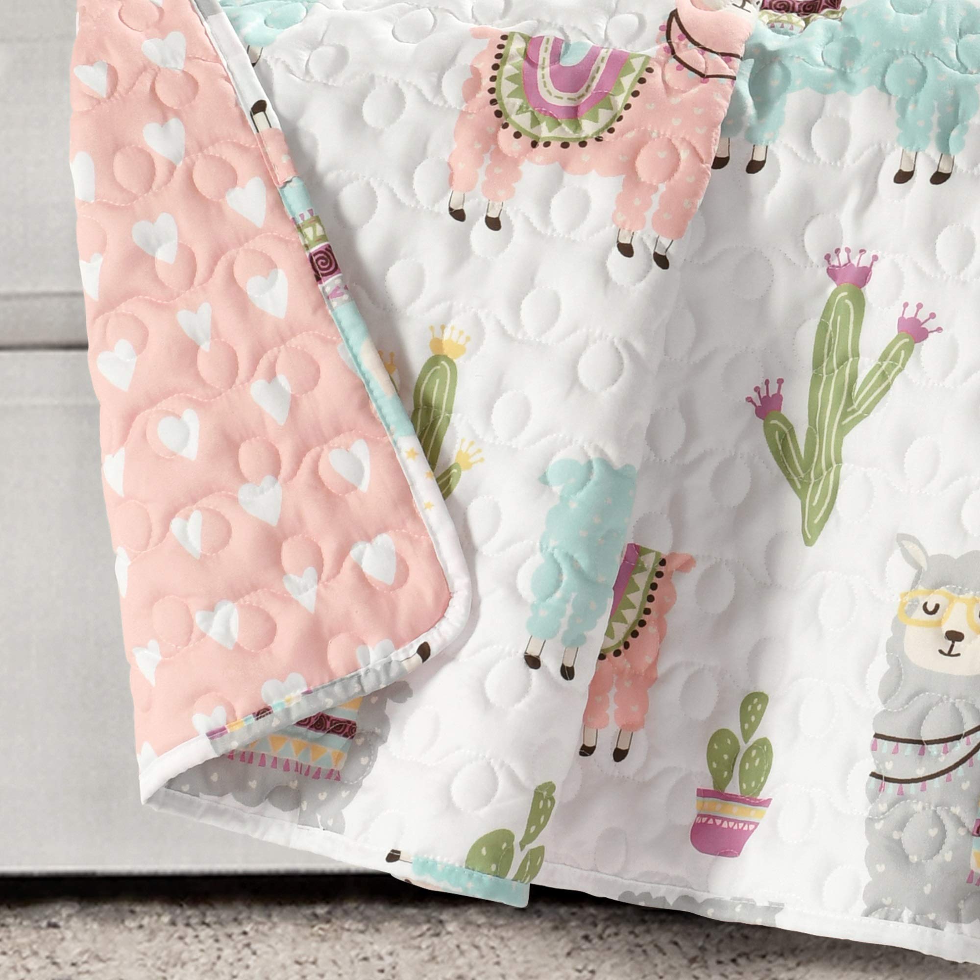 Lush Decor Southwest llama and cactus toddler throw blanket with white and blush colors, reversible boho quilted design for kids room