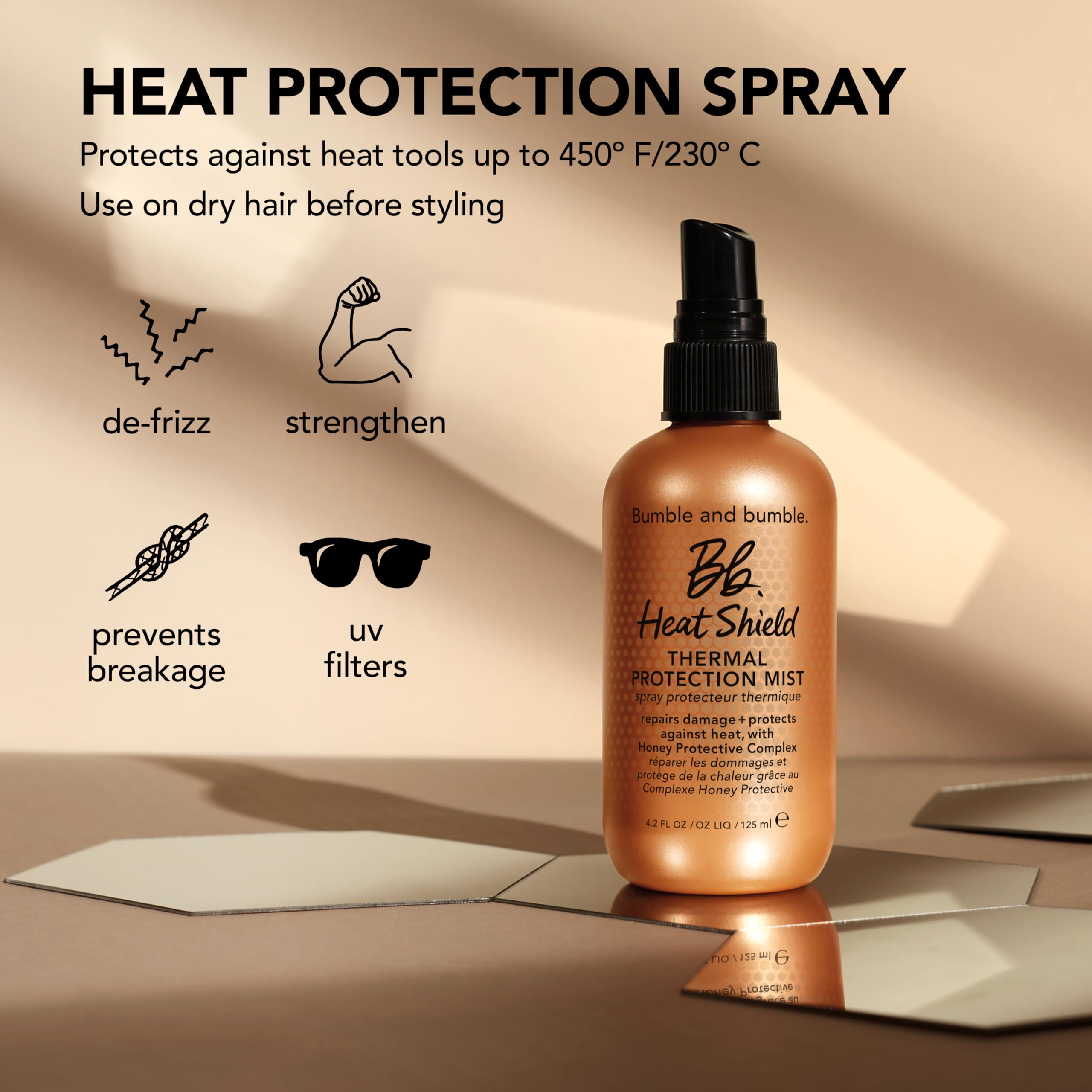 Bumble and bumble Heat Shield Thermal Mist in a 2 fl oz spray bottle, used to protect hair from heat styling damage.