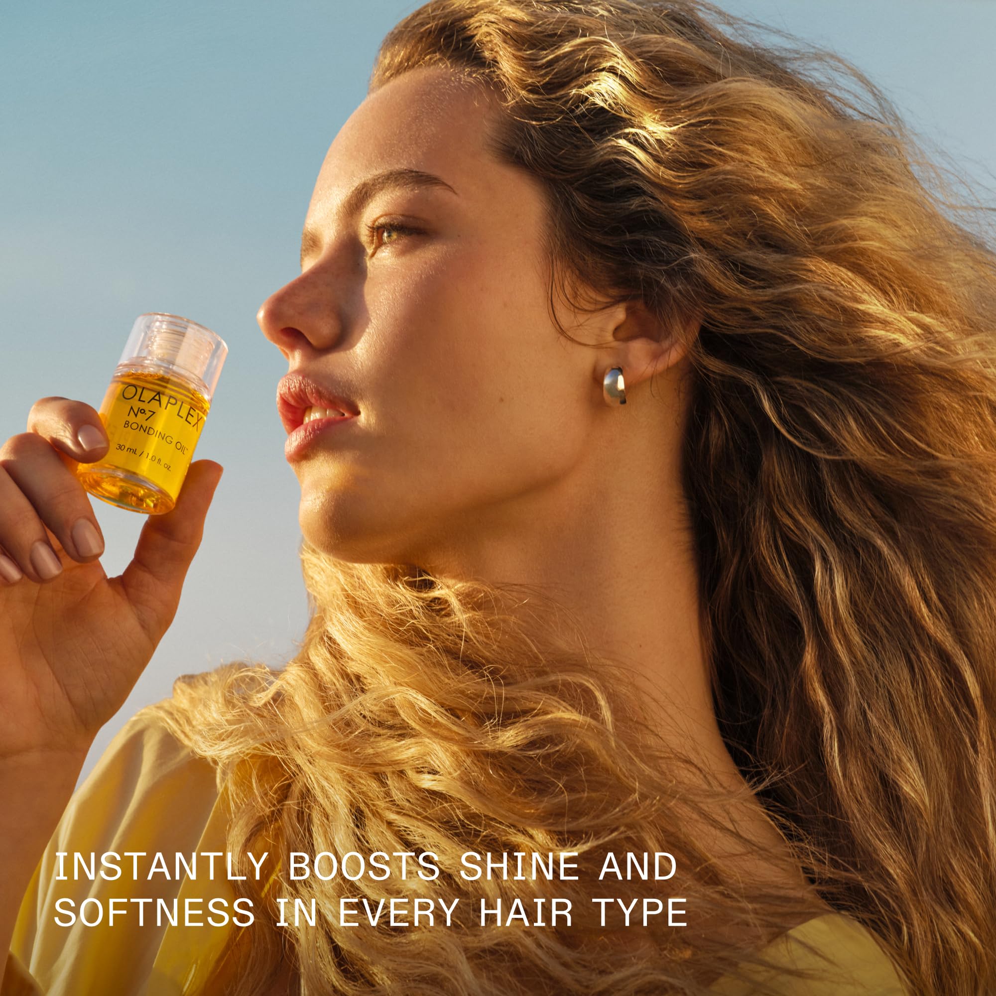 Olaplex No.7 Bonding Hair Oil in 30 mL, high-shine styling oil for damaged or colored hair, displayed in a clear bottle.
