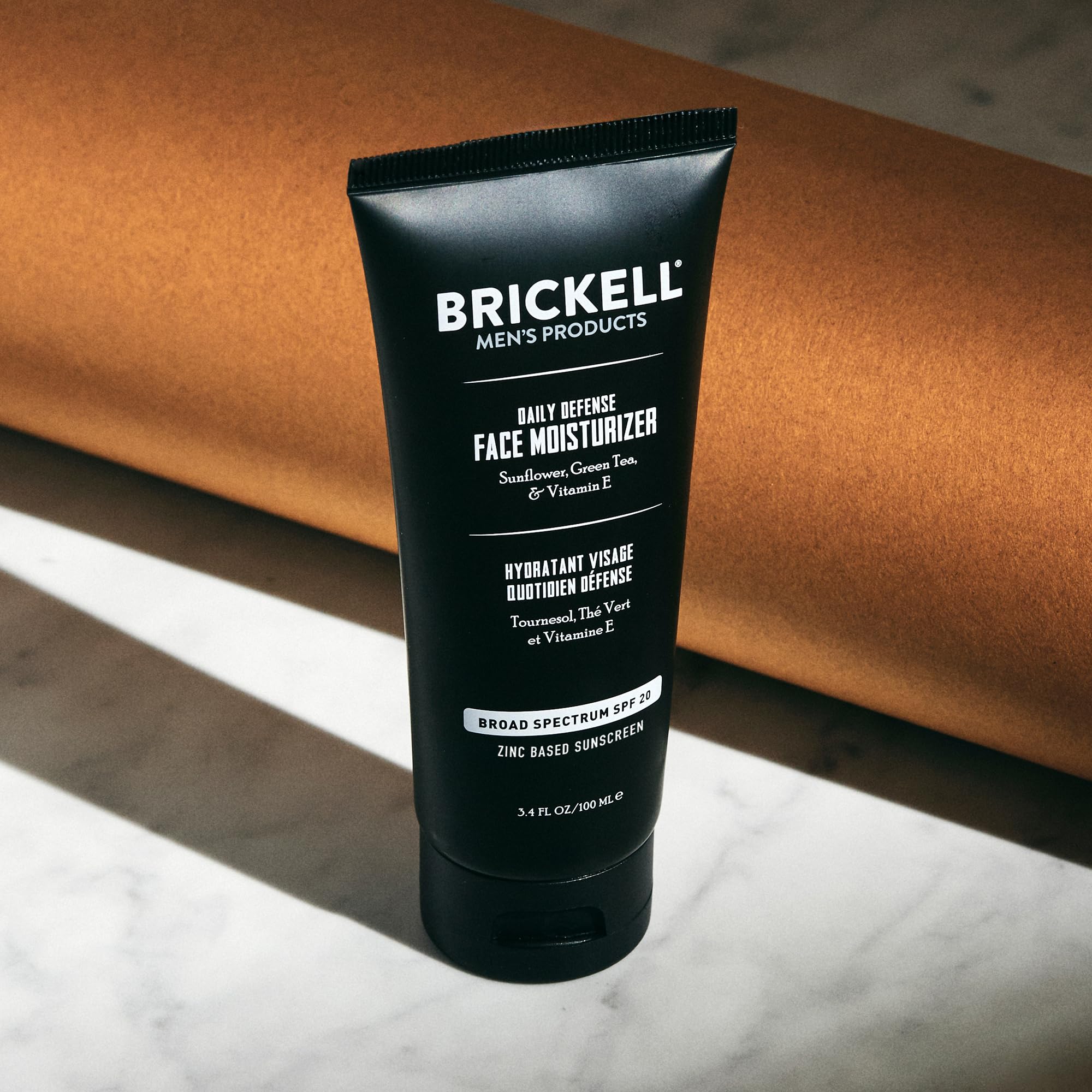 Brickell Men's Daily Defense SPF20 face moisturizer with zinc, green tea, and vitamin E, protecting and hydrating men's skin.