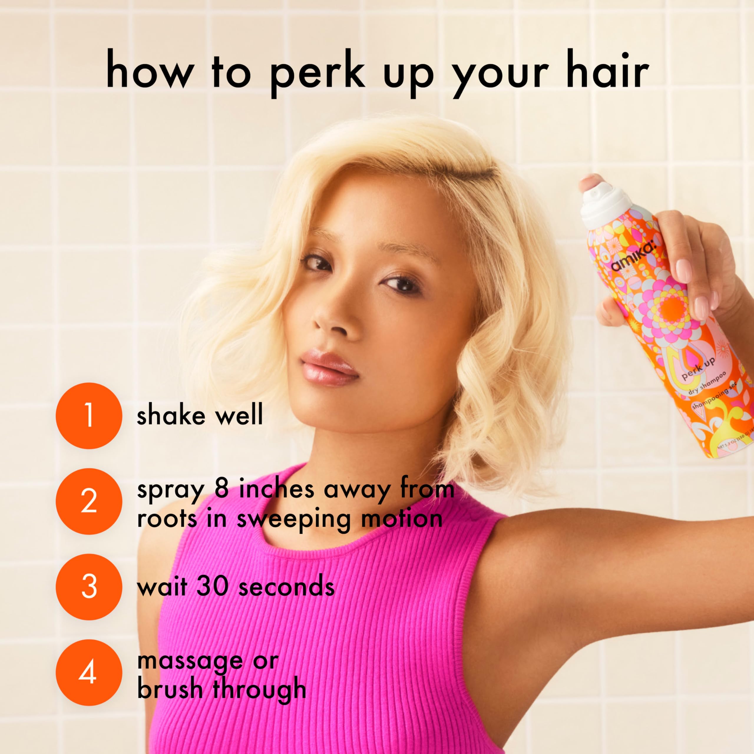 Amika Perk Up Dry Shampoo in 5.3 oz spray bottle, lightweight formula for fresh, clean hair without water.