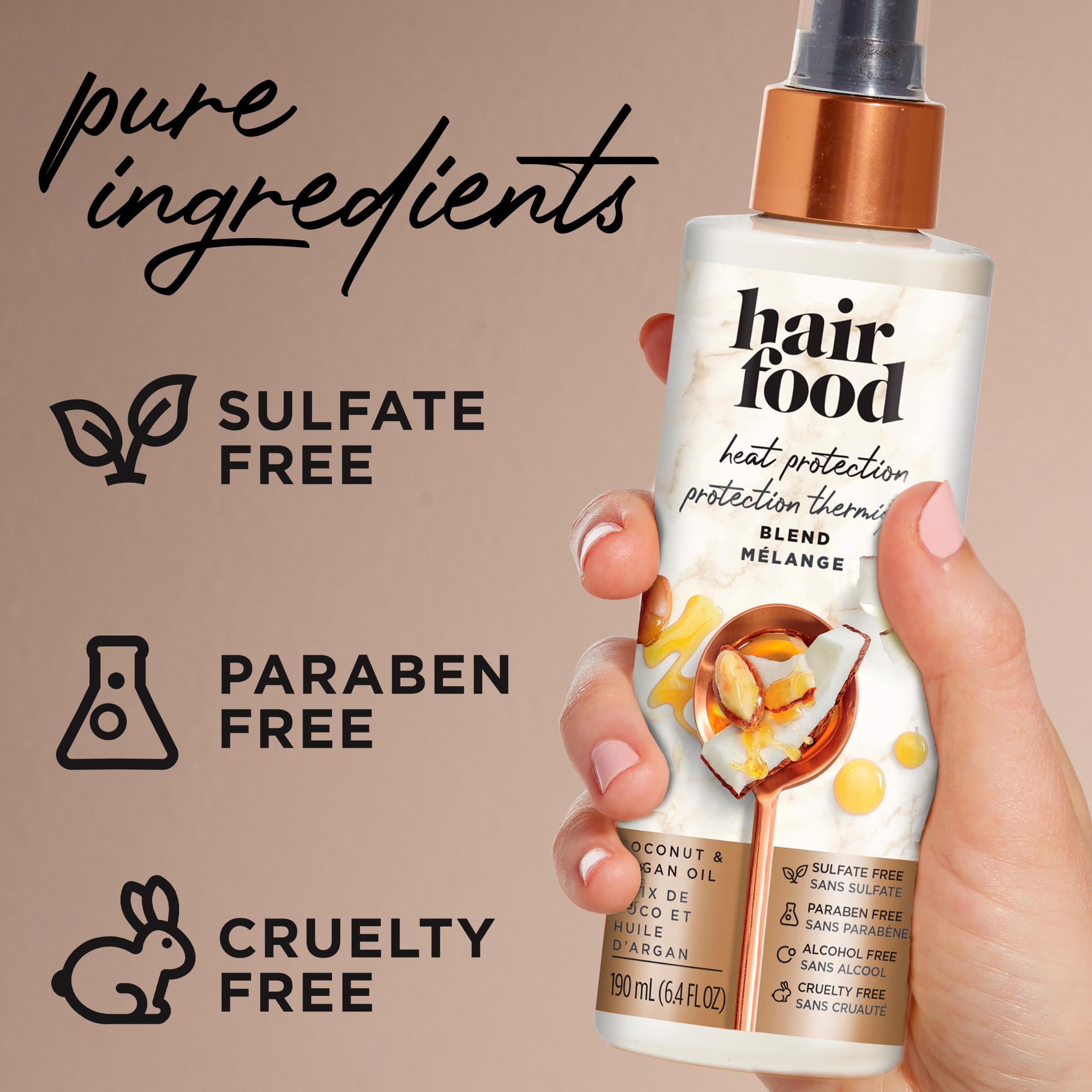 Hair Food Coconut & Argan Oil Heat Protectant Spray bottle, 6.4 fl oz, with coconut and argan oil ingredients visible.