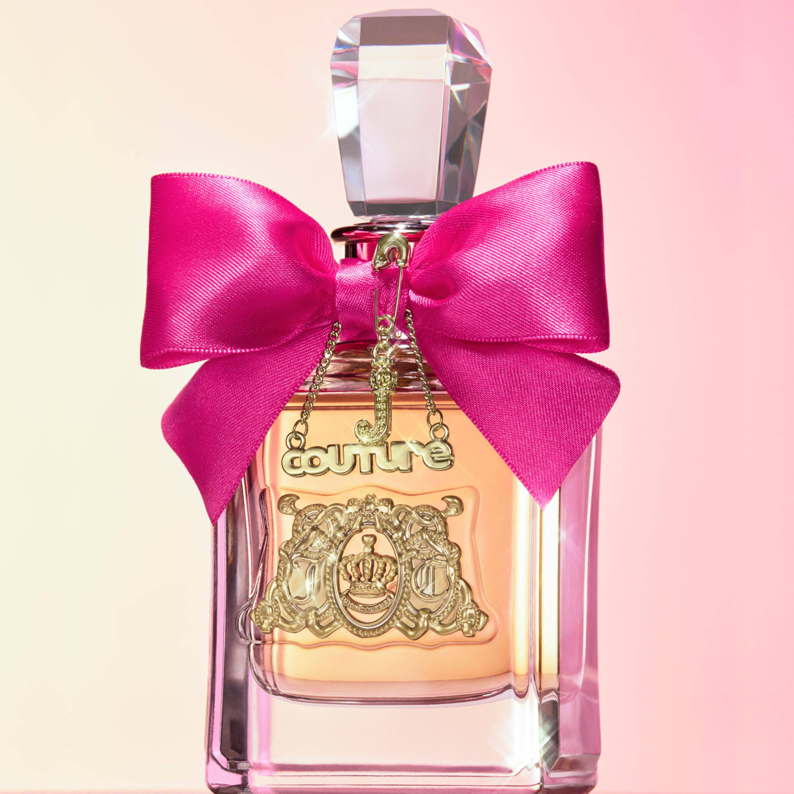 Juicy Couture Viva La Juicy Eau de Parfum spray for women, featuring a sleek bottle with pink accents and floral design.