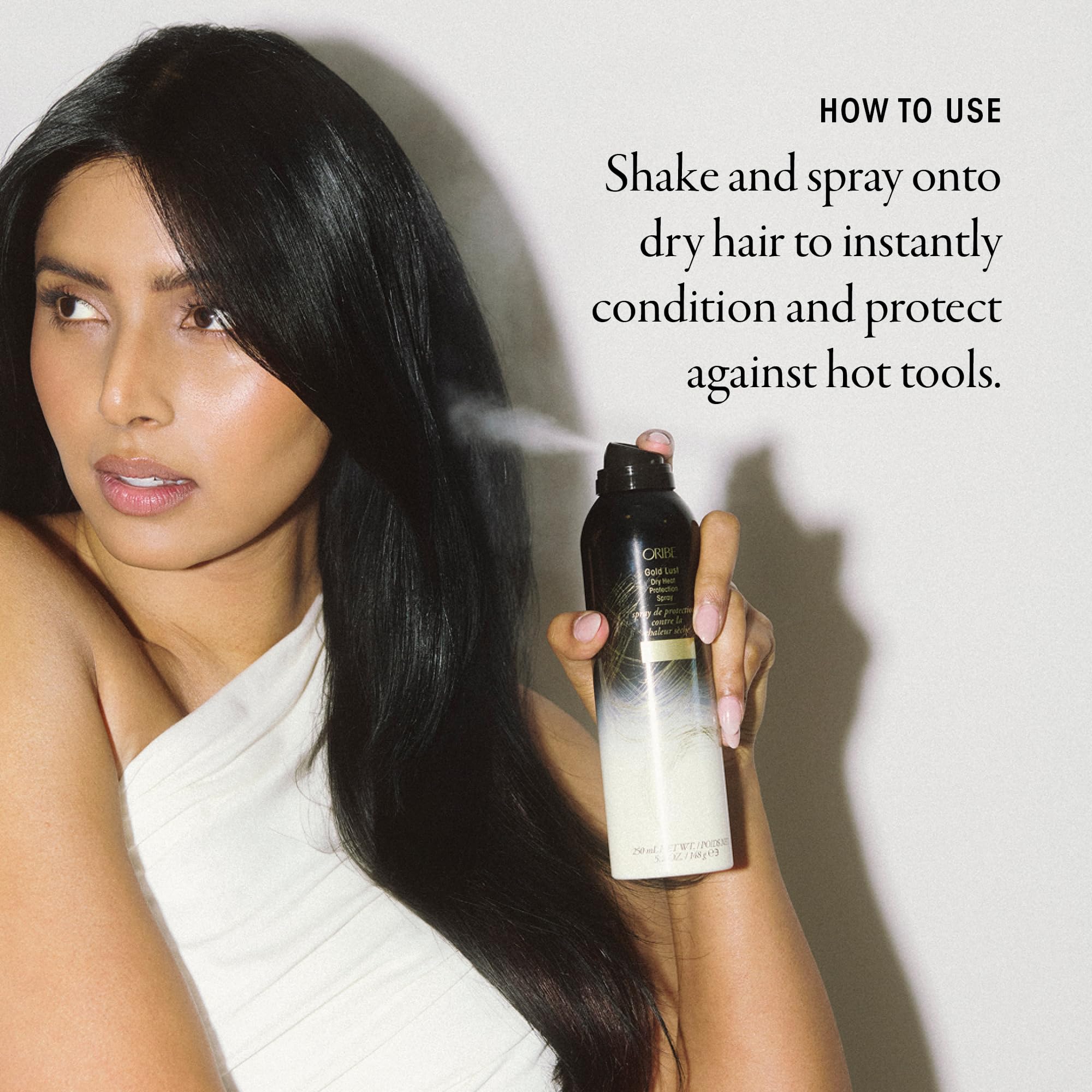 Oribe Gold Lust Heat Protection Spray in 5.2oz bottle, designed for styling and protecting hair up to 450°F.