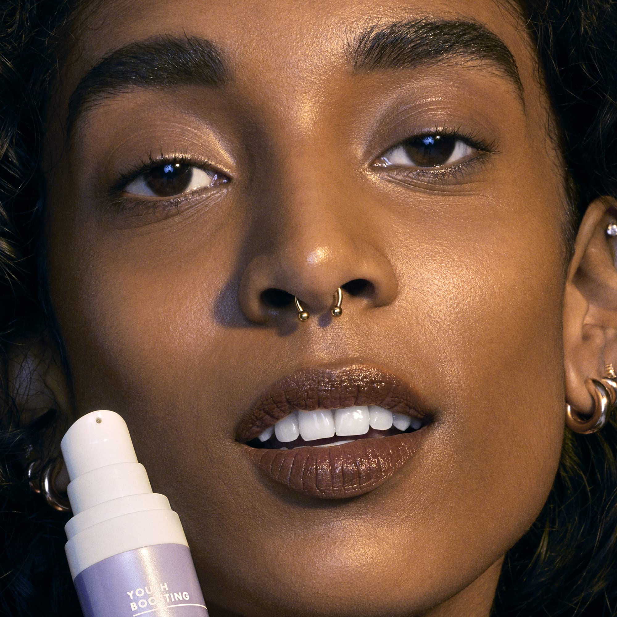 e.l.f. SKIN Youth Boosting Advanced Night Retinoid Serum in a clear glass bottle with dropper for skincare treatment.