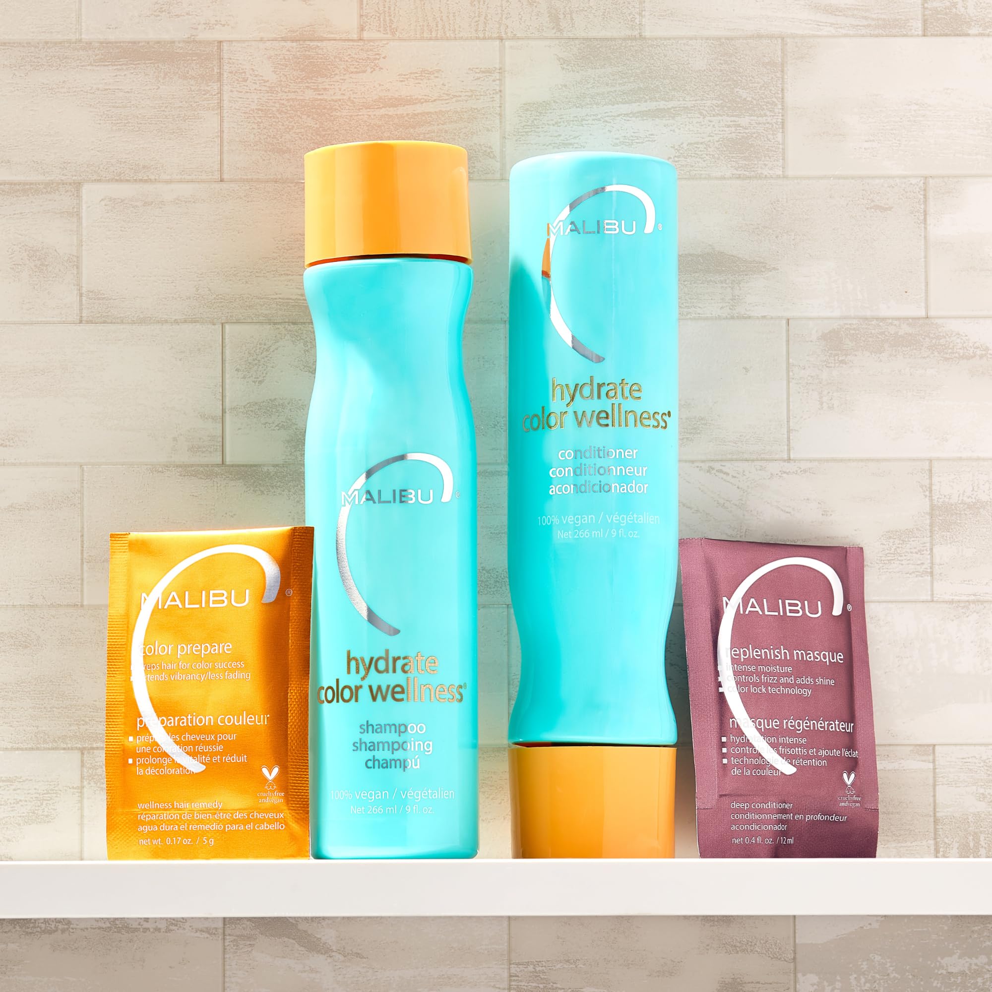 Malibu C Color-Safe Shampoo and Hydrating Hair Remedy Kit with bottles of hair cleaner and conditioner for color-treated hair.