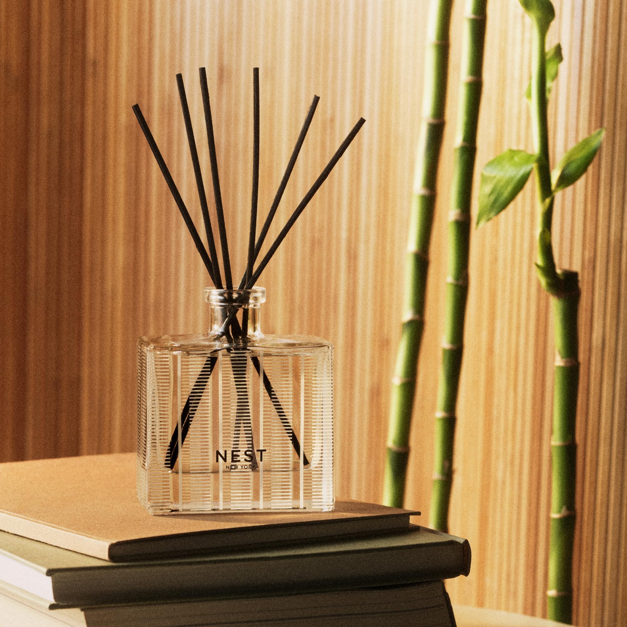NEST New York bamboo reed diffuser refill bottle with 5.9 fl oz of aromatic liquid for home scenting.