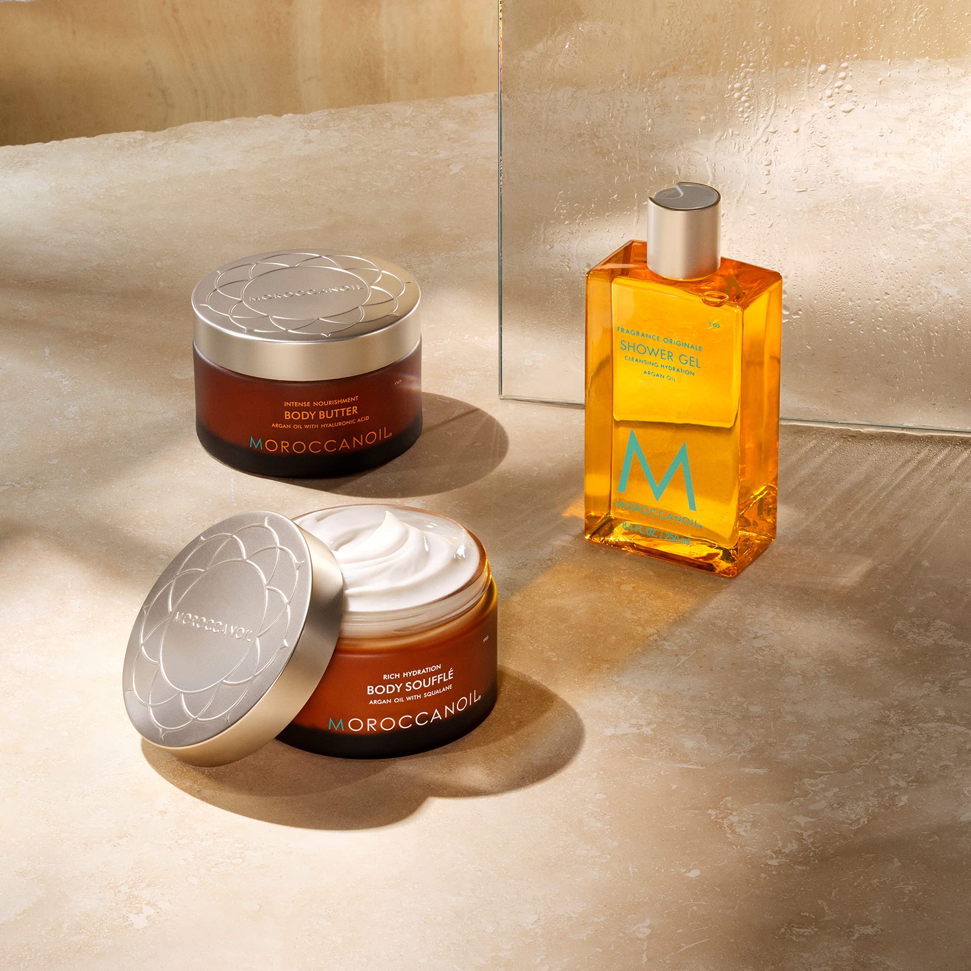 Moroccanoil Body Soufflé Fragrance Originale in 6.7 oz jar, soft and lightweight moisturizing body cream with a floral scent.