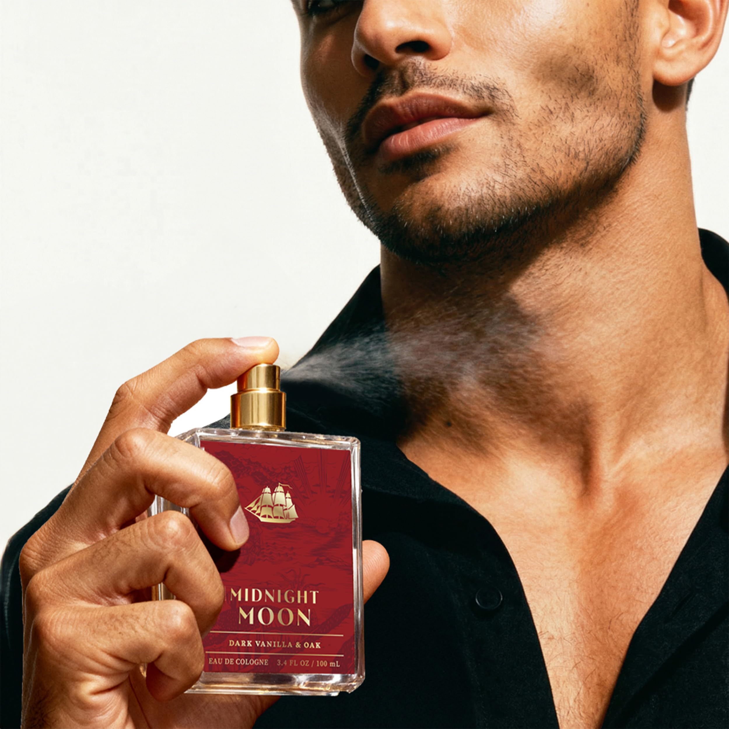 Old Spice Midnight Moon men's cologne bottle, 3.4 fl oz, featuring sleek packaging and dark blue design.